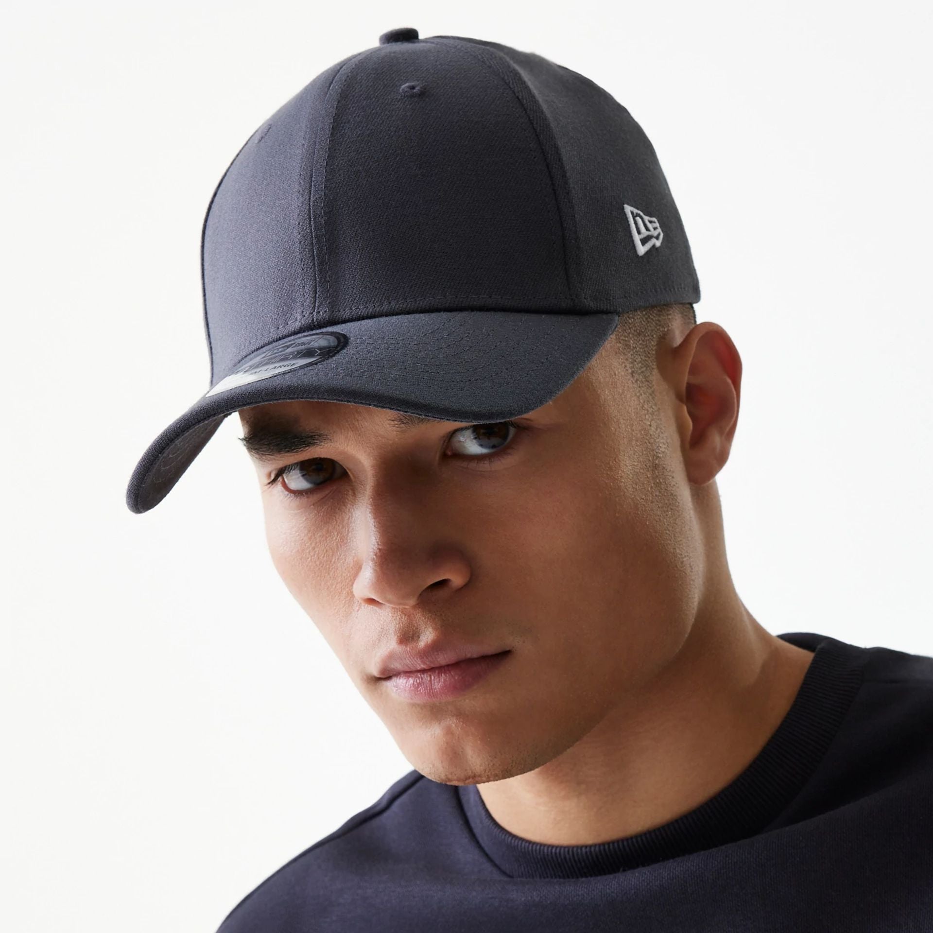 This is a New Era Flag Graphite Grey 39THIRTY Cap 1