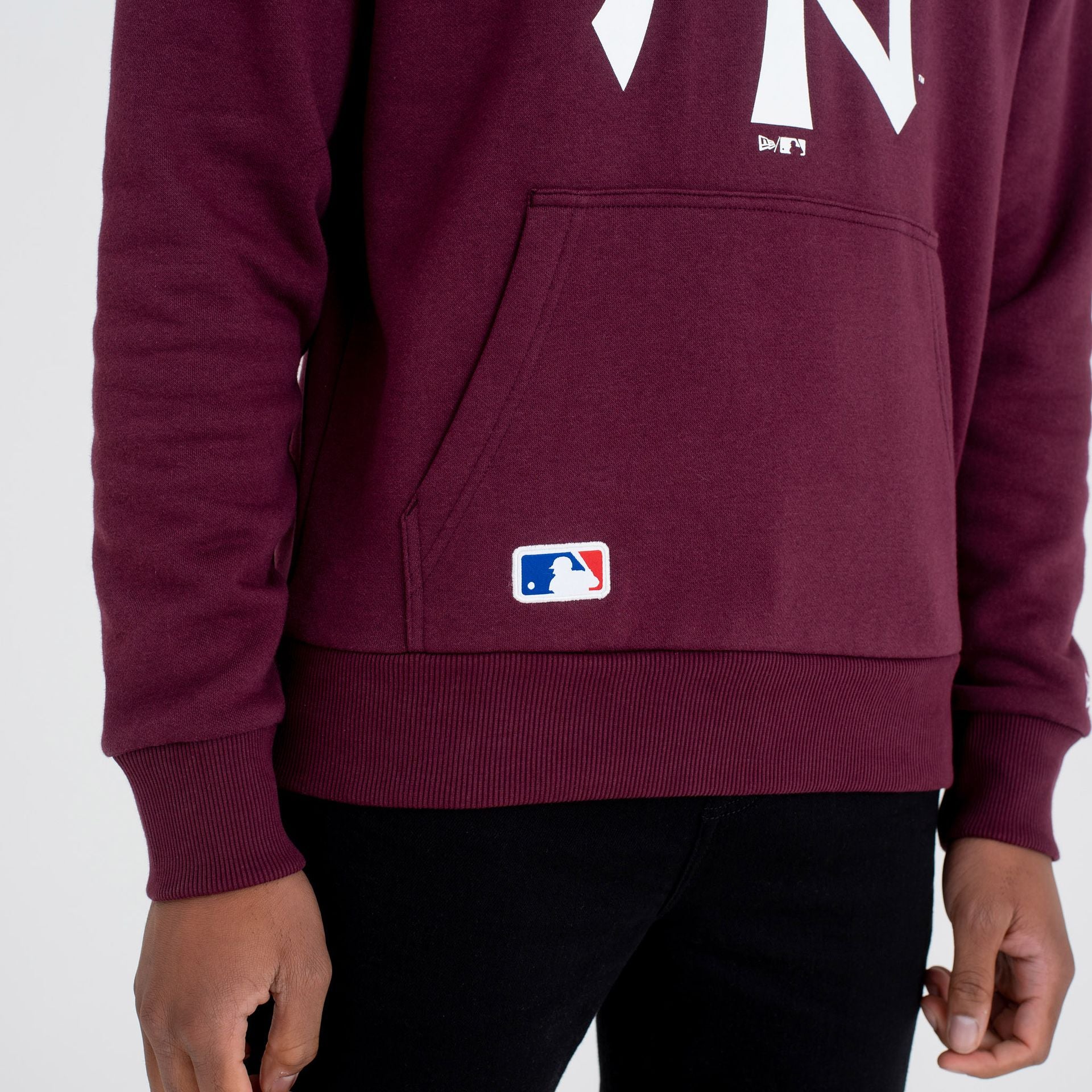 The Male model is wearing New York Yankees Team Logo Maroon Hoodie 2