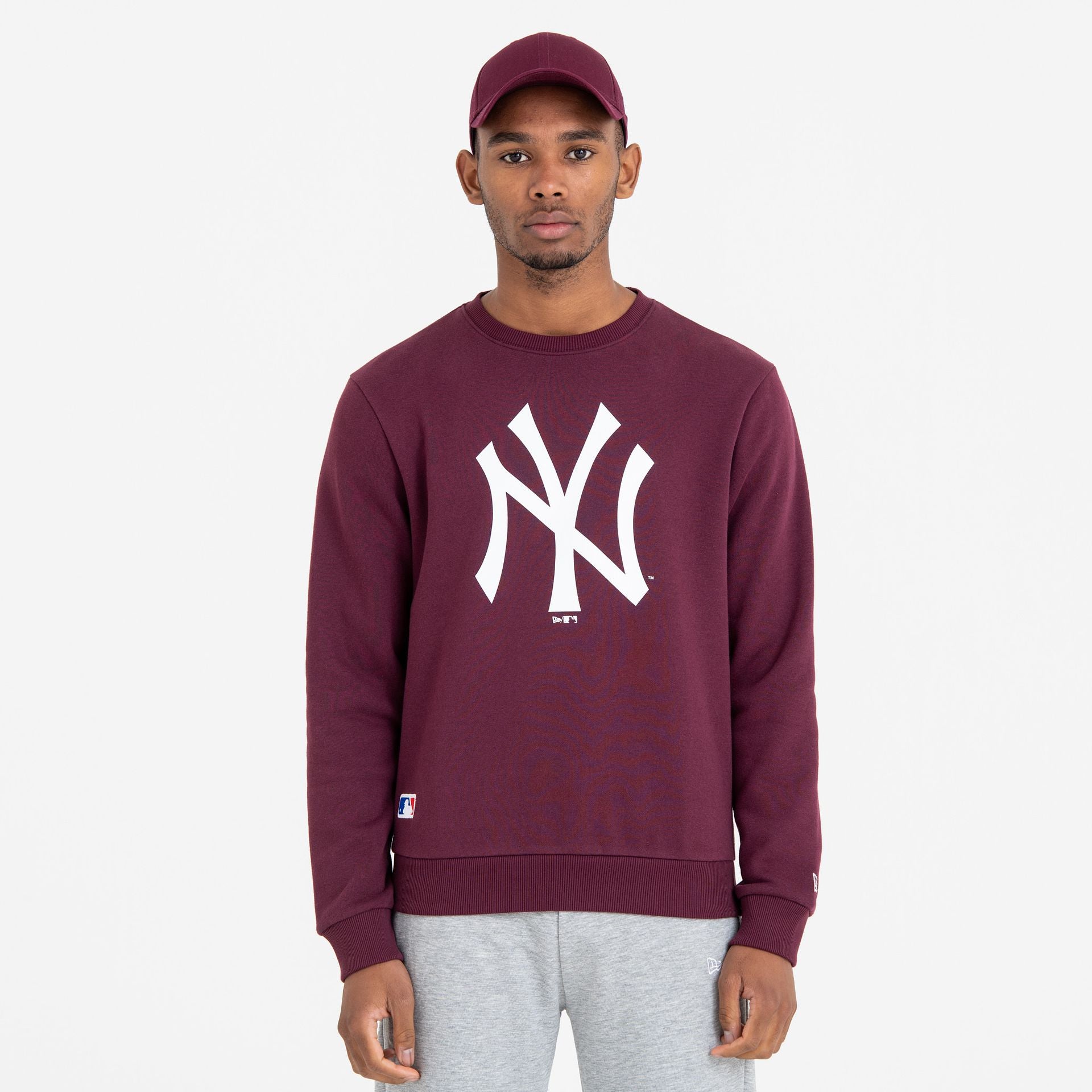 The Male model is wearing New York Yankees MLB Team Logo Maroon Crew Neck Sweatshirt 1