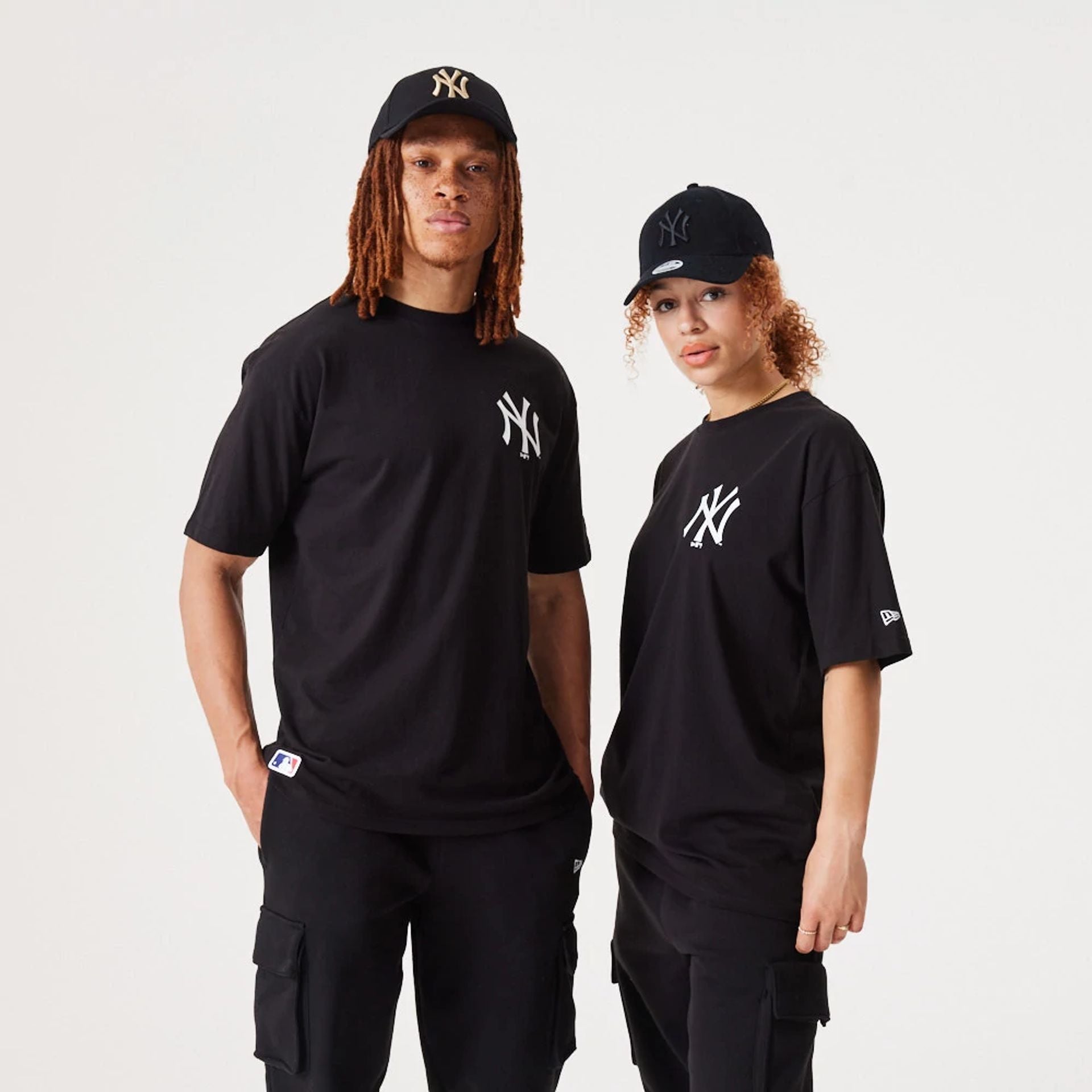 The Male model is wearing New York Yankees Essentials Oversized Black T-Shirt 1