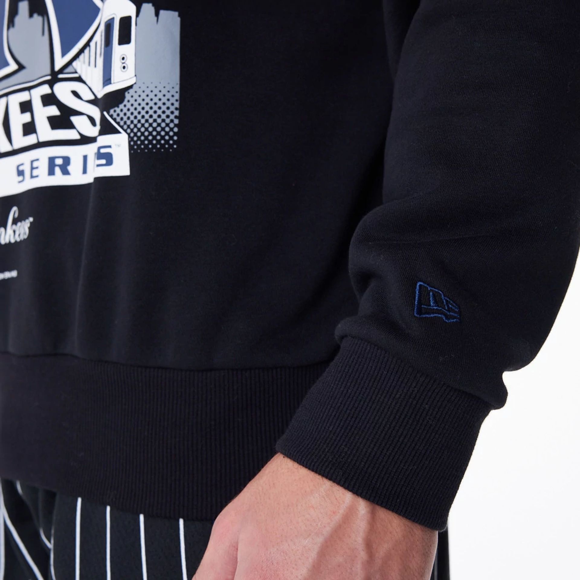 The Male model is wearing New York Yankees New Era Australia Black Oversized Sweater 2