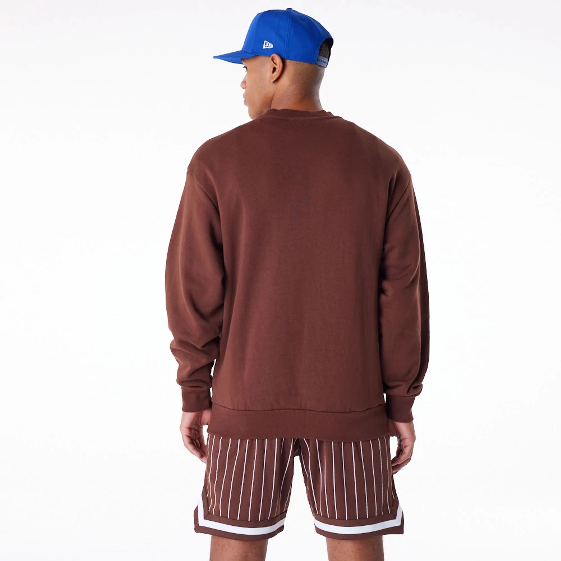 The Male model is wearing Subway Series New Era Australia Brown Oversized Sweater 2