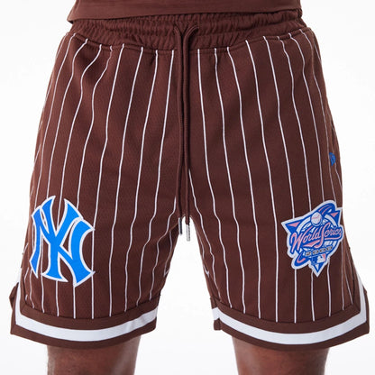 The Male model is wearing New York Yankees Pinstripe New Era Australia Brown Shorts 3