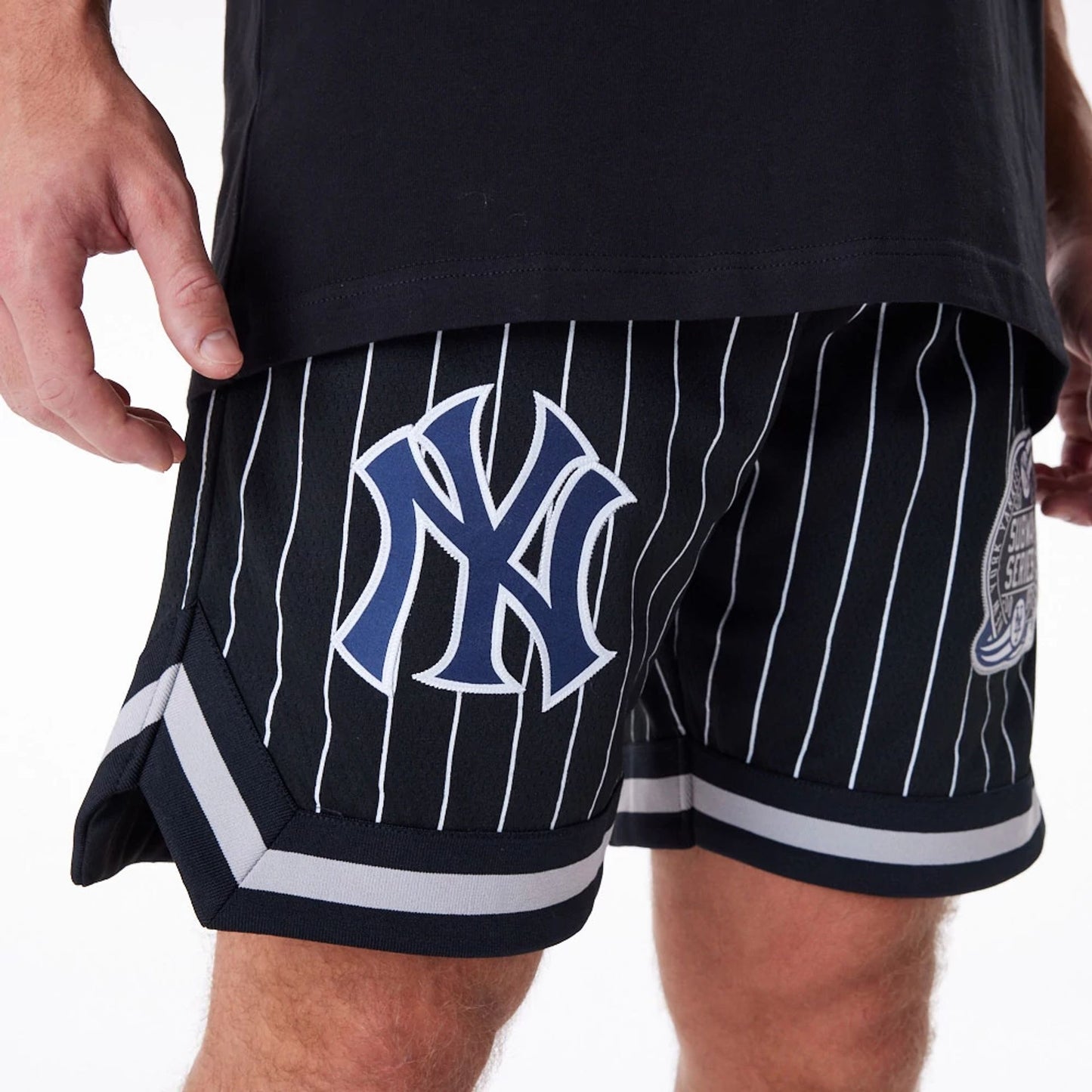 The Male model is wearing New York Yankees Pinstripe New Era Australia Black Shorts 6