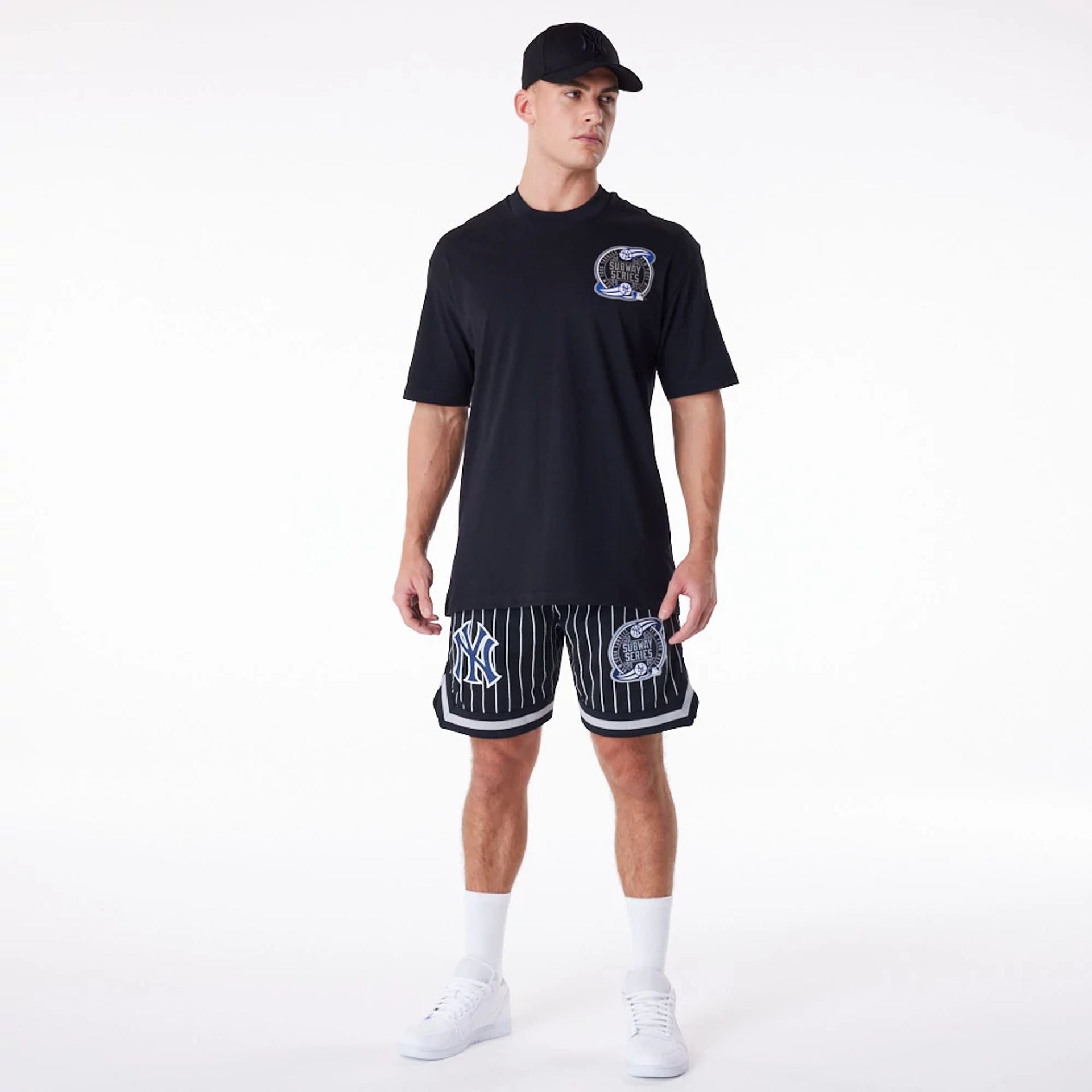 The Male model is wearing New York Yankees Pinstripe New Era Australia Black Shorts 3