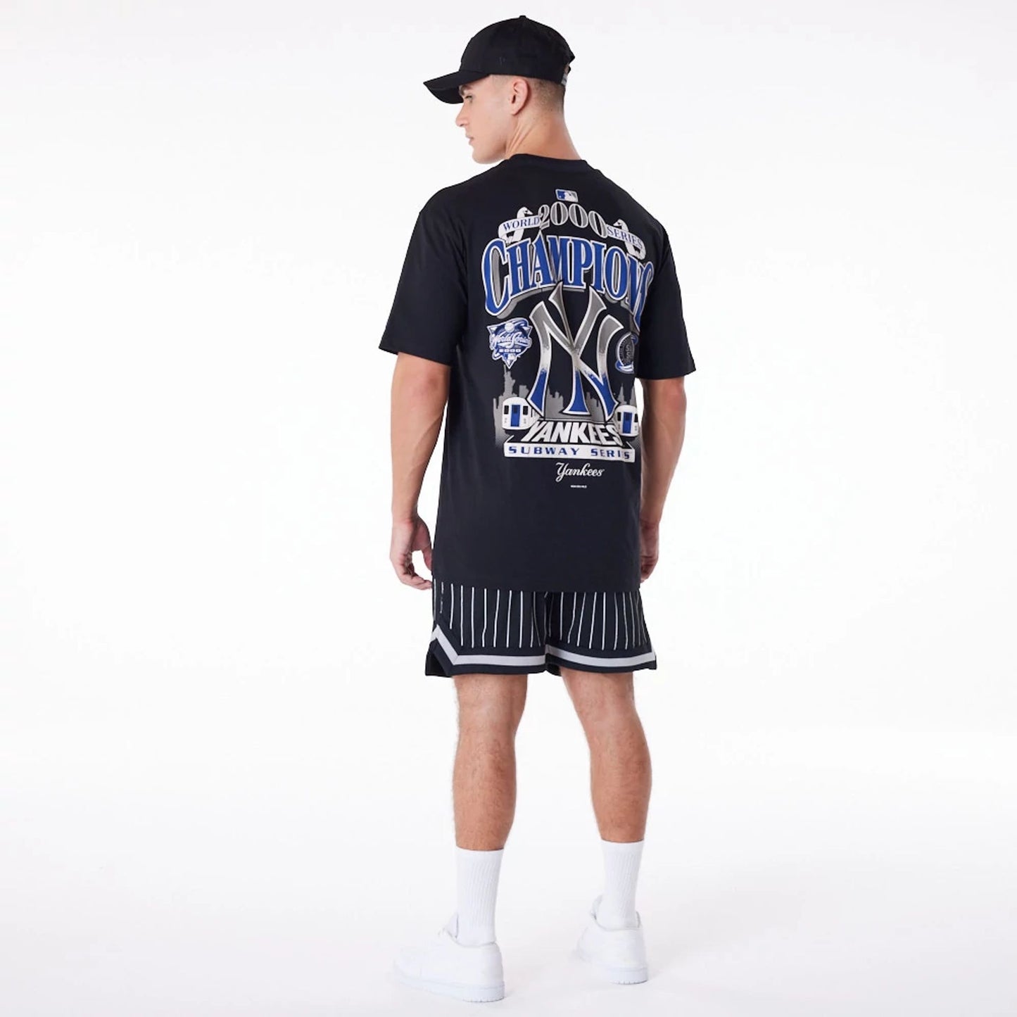 The Male model is wearing New York Yankees Pinstripe New Era Australia Black Shorts 4