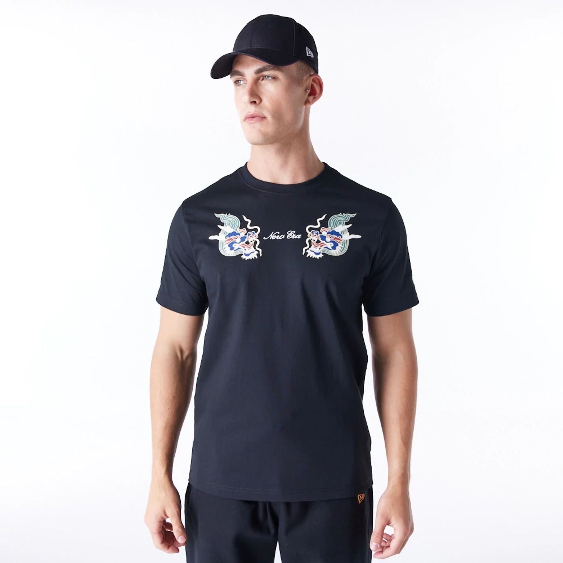 The Male model is wearing New Era Year Of The Dragon Black T-Shirt 1