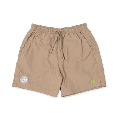 The Male model is wearing New Era Earth Day Beige Shorts 1