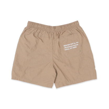 The Male model is wearing New Era Earth Day Beige Shorts 2