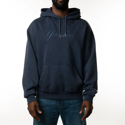 The Male model is wearing New York Yankees New Era Australia Dark Blue Oversized Pullover Hoodie  1