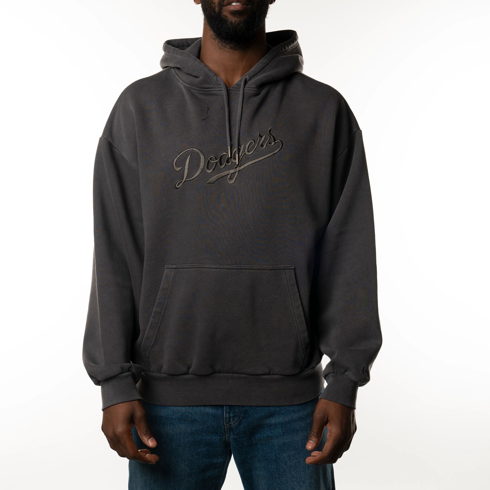 The Male model is wearing LA Dodgers New Era Australia Charcoal Oversized Pullover Hoodie  3