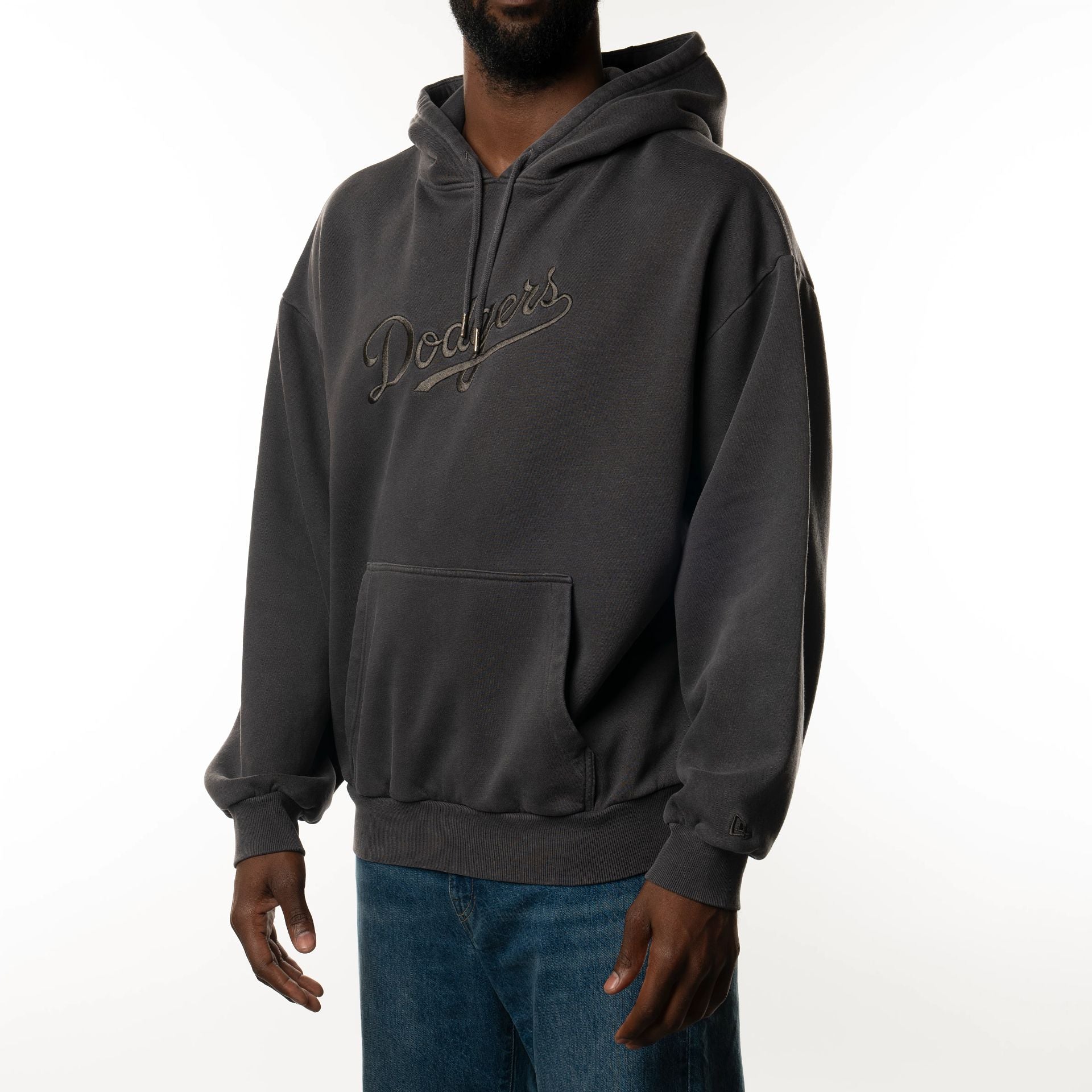 The Male model is wearing LA Dodgers New Era Australia Charcoal Oversized Pullover Hoodie  1