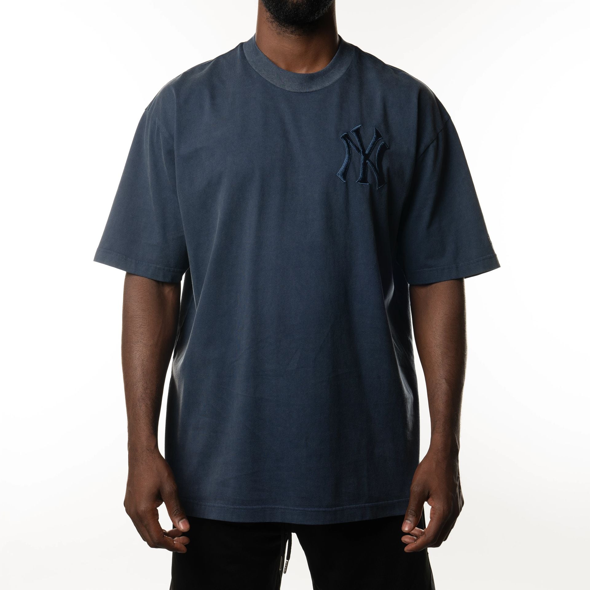 The Male model is wearing New York Yankees New Era Australia Dark Blue Oversized T-Shirt  1