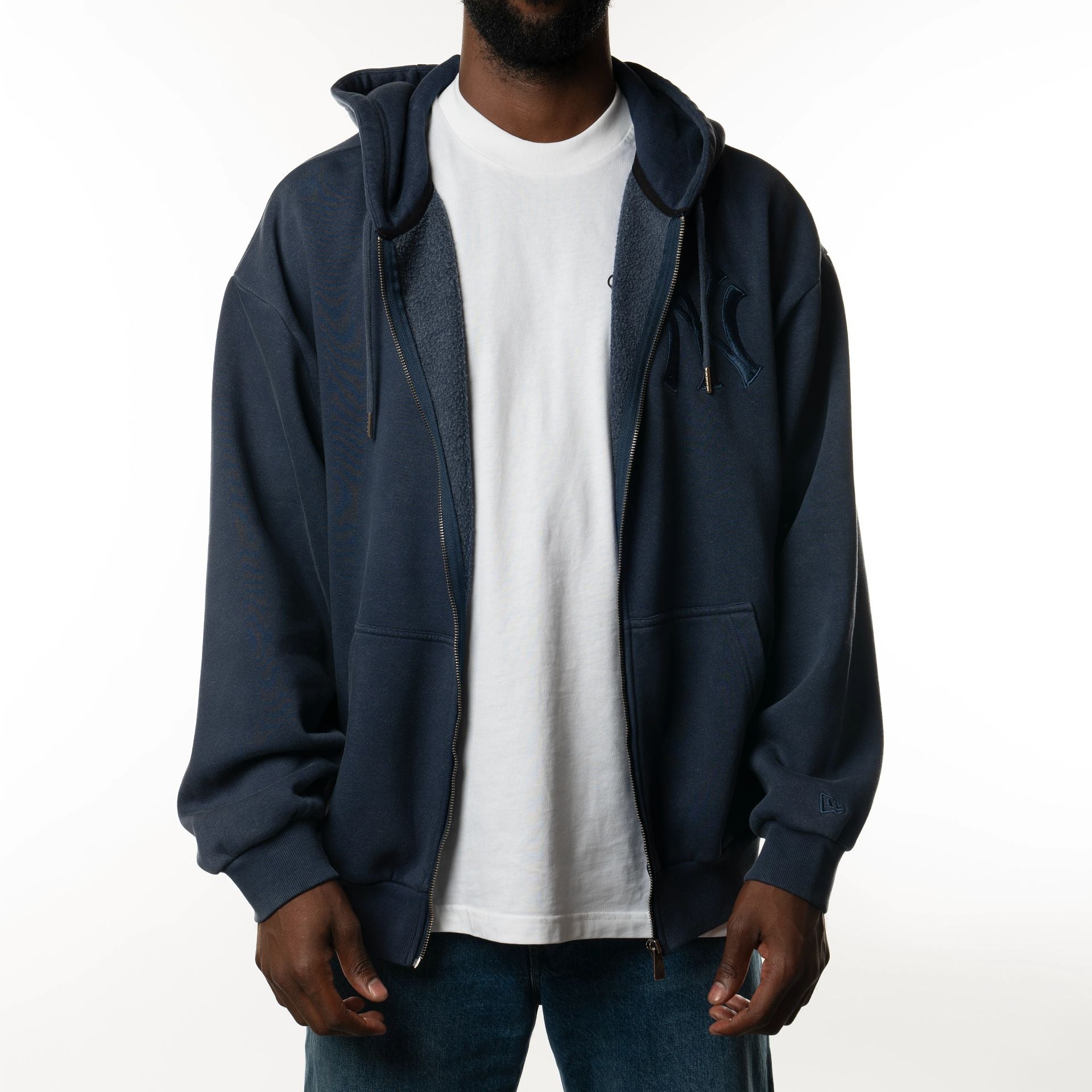 The Male model is wearing New York Yankees New Era Australia Dark Blue Oversized Full Zip Hoodie  7