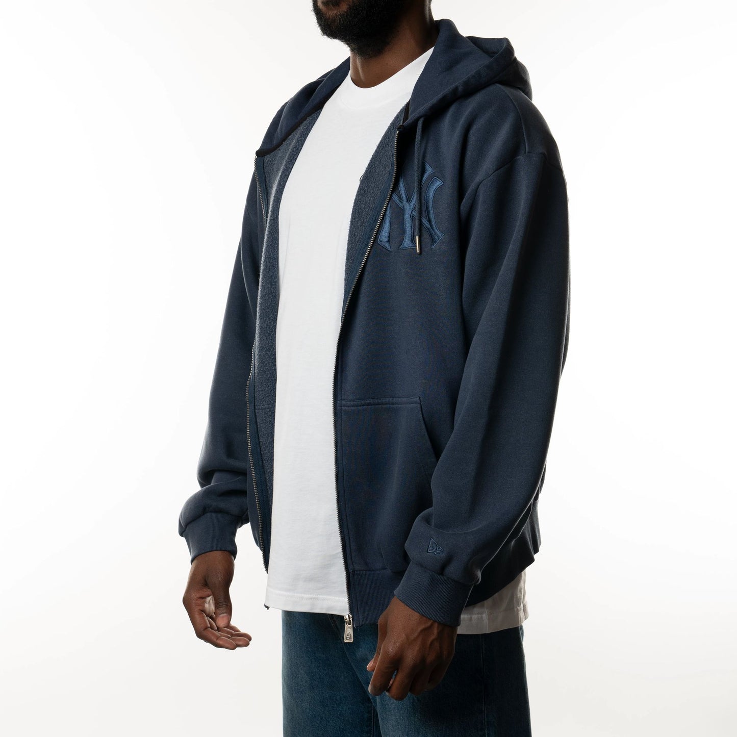 The Male model is wearing New York Yankees New Era Australia Dark Blue Oversized Full Zip Hoodie  6