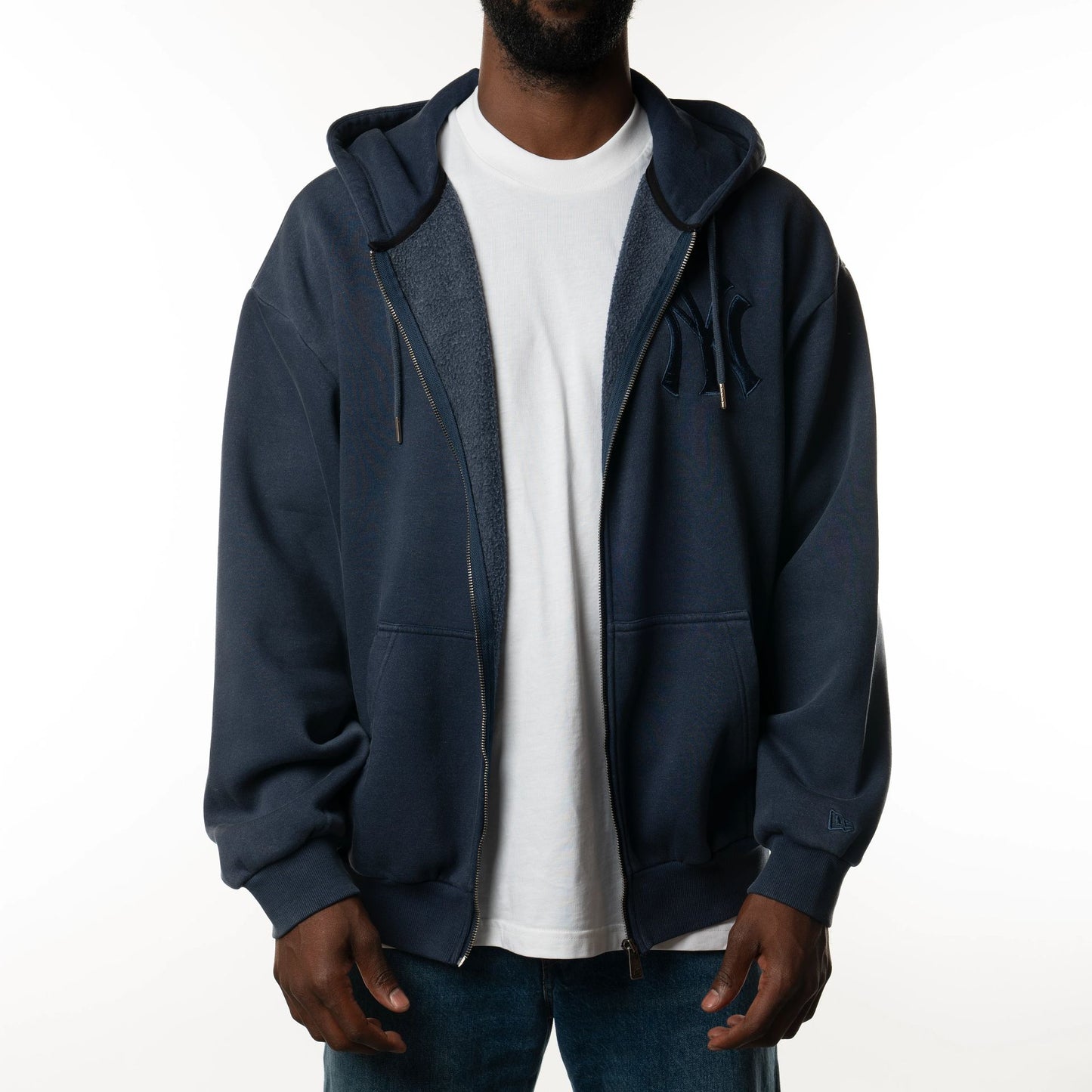 The Male model is wearing New York Yankees New Era Australia Dark Blue Oversized Full Zip Hoodie  1