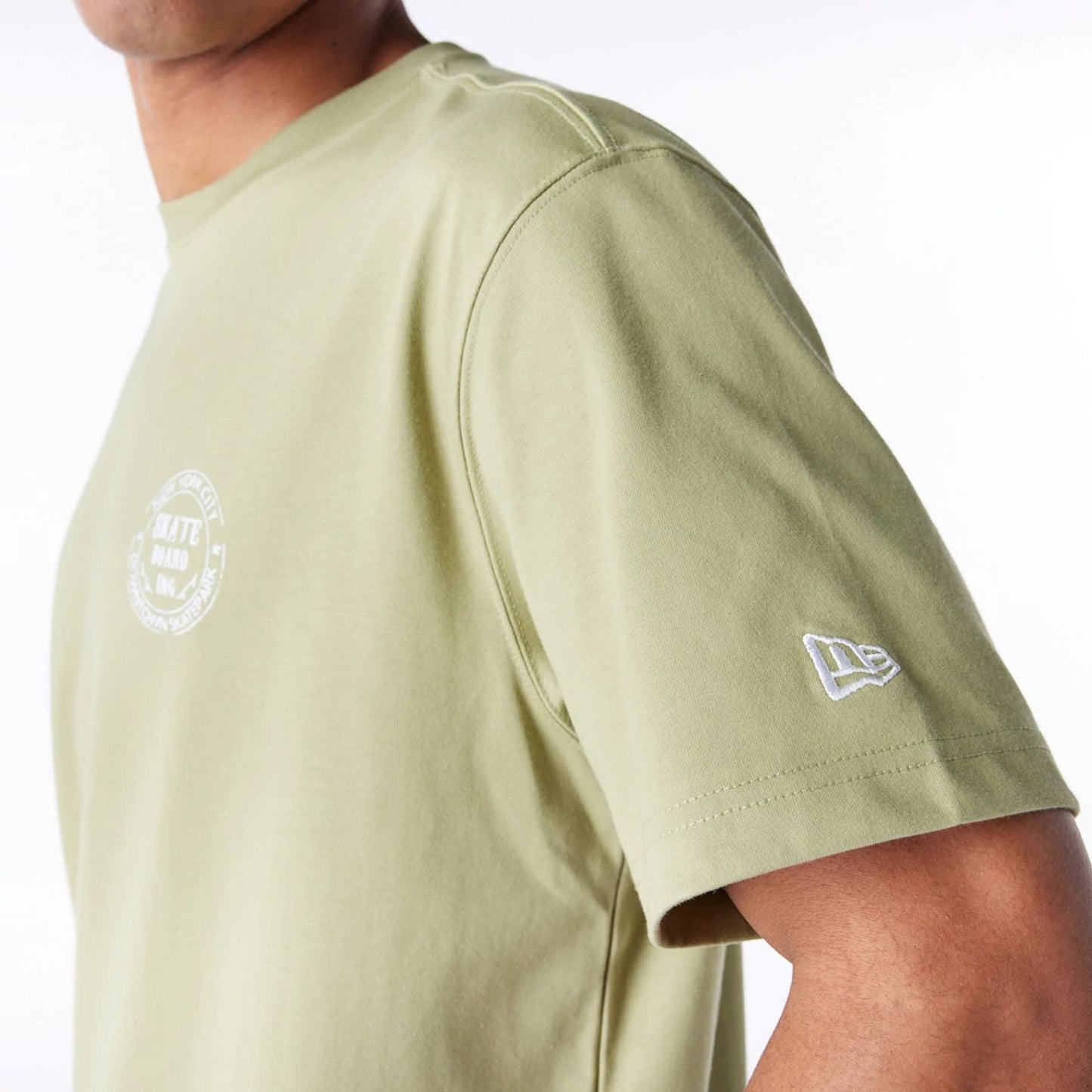 The Male model is wearing New Era Korea Skateboard Green T-Shirt 6