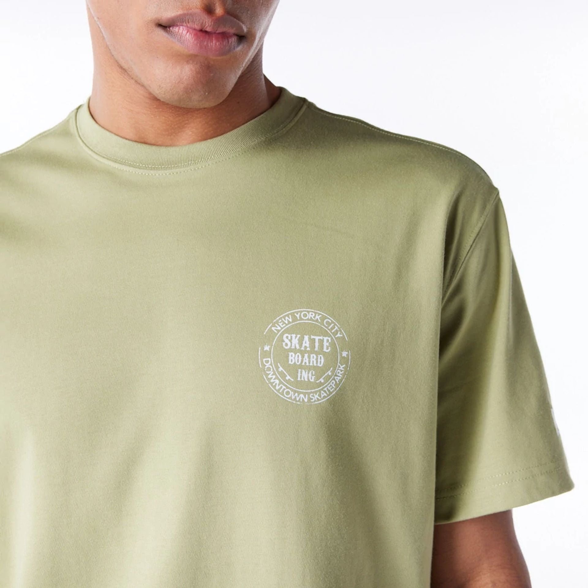 The Male model is wearing New Era Korea Skateboard Green T-Shirt 5