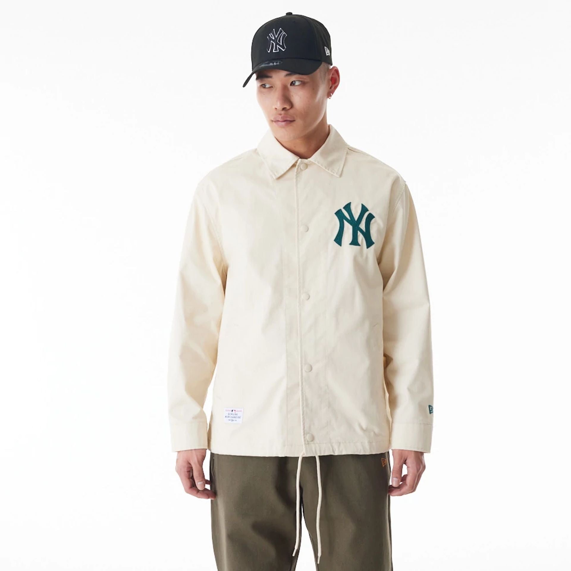 The Male model is wearing New York Yankees New Era Korea MLB Coach Off White Jacket 1