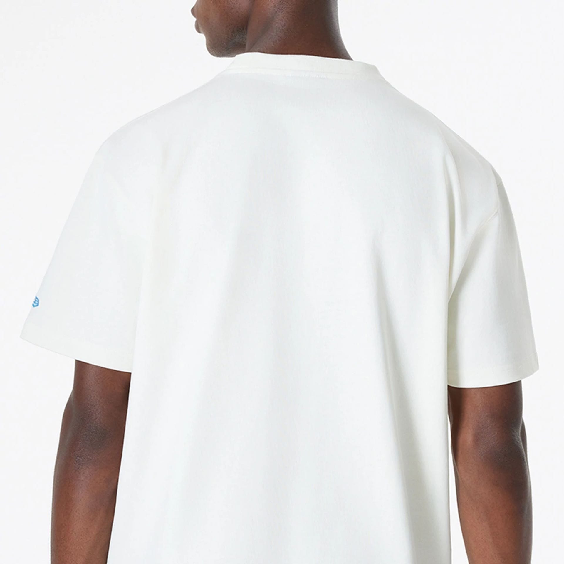 The Male model is wearing Ricardo Luévanos x New Era White T-Shirt 7