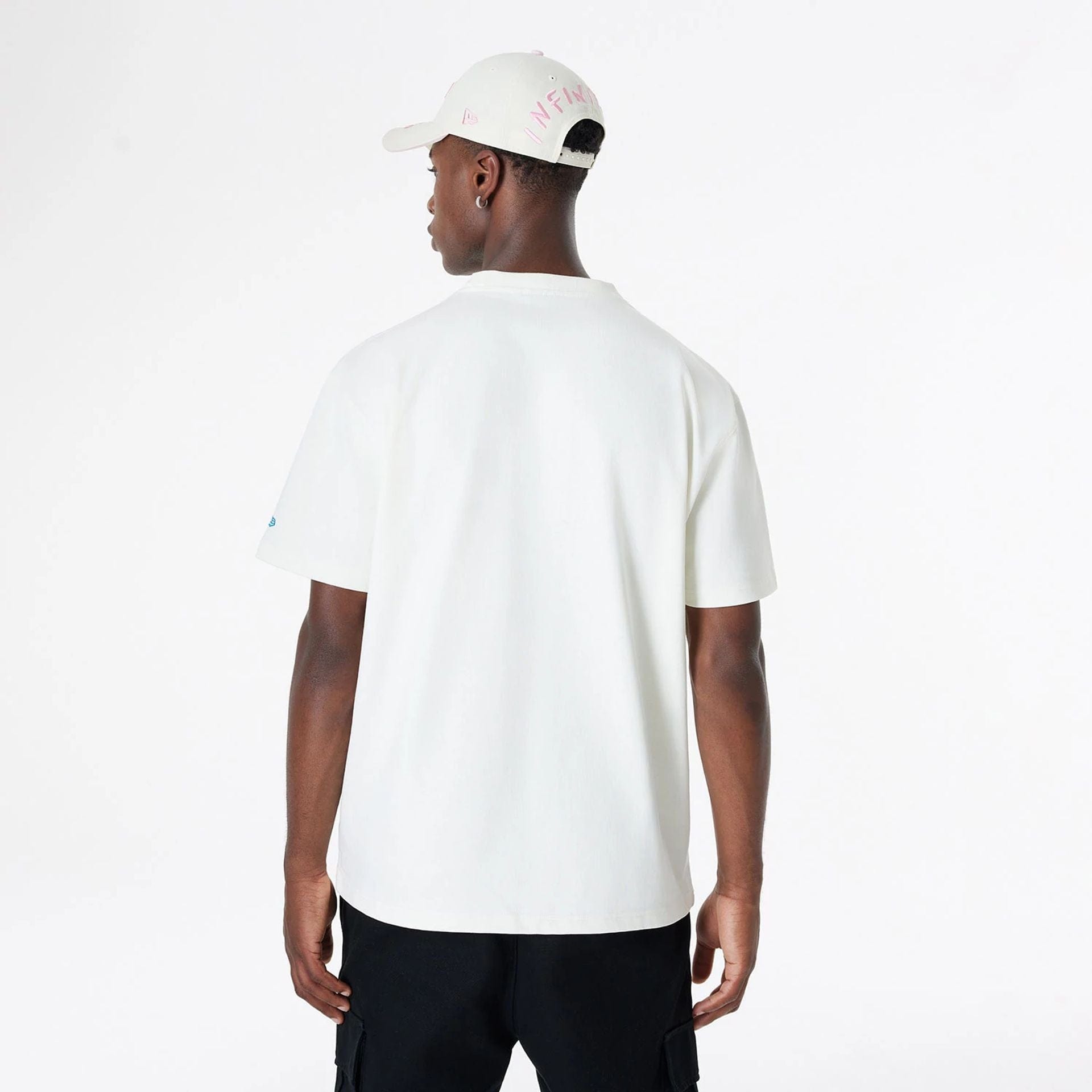 The Male model is wearing Ricardo Luévanos x New Era White T-Shirt 2