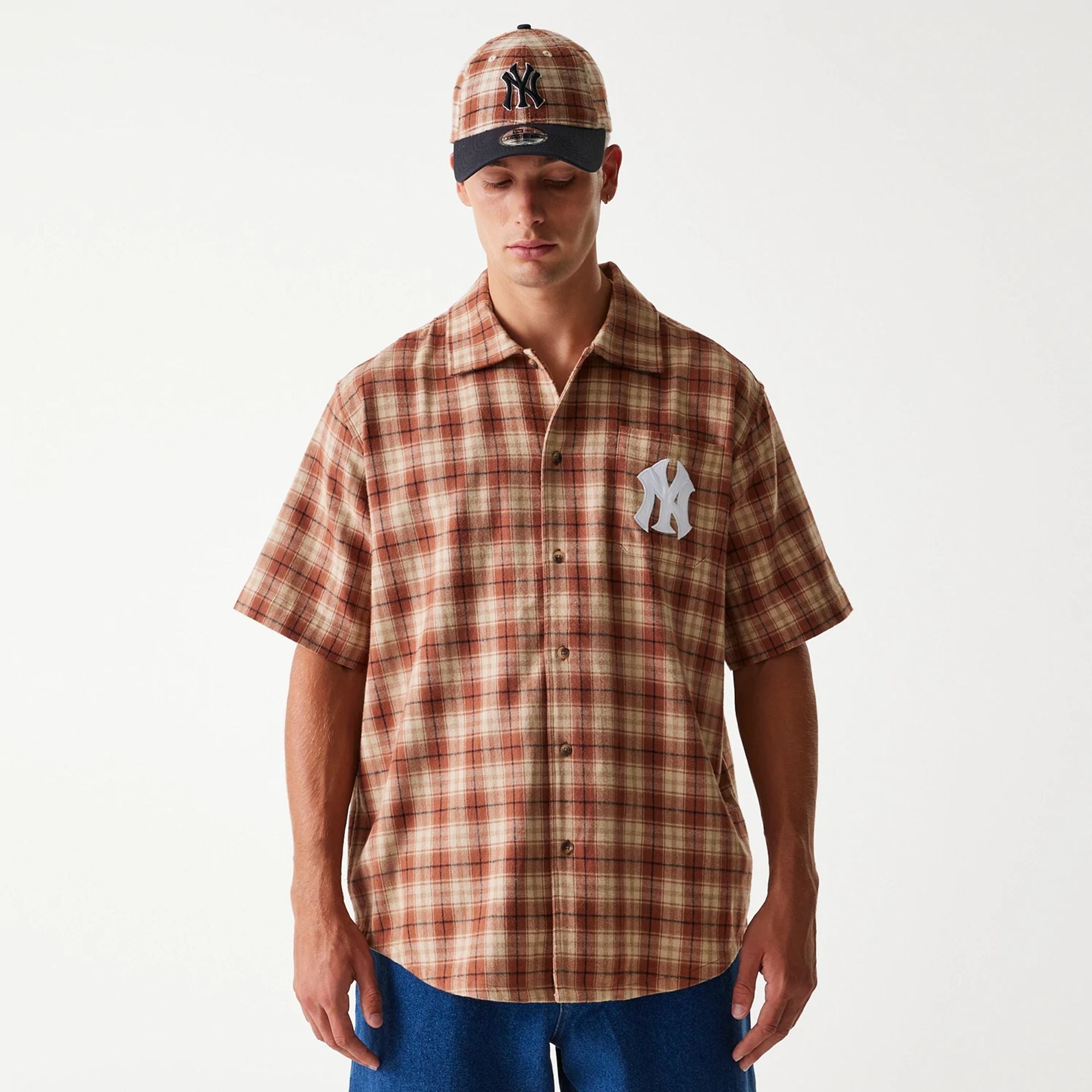 The Male model is wearing New York Yankees Plaid Brown Short Sleeve Shirt 1