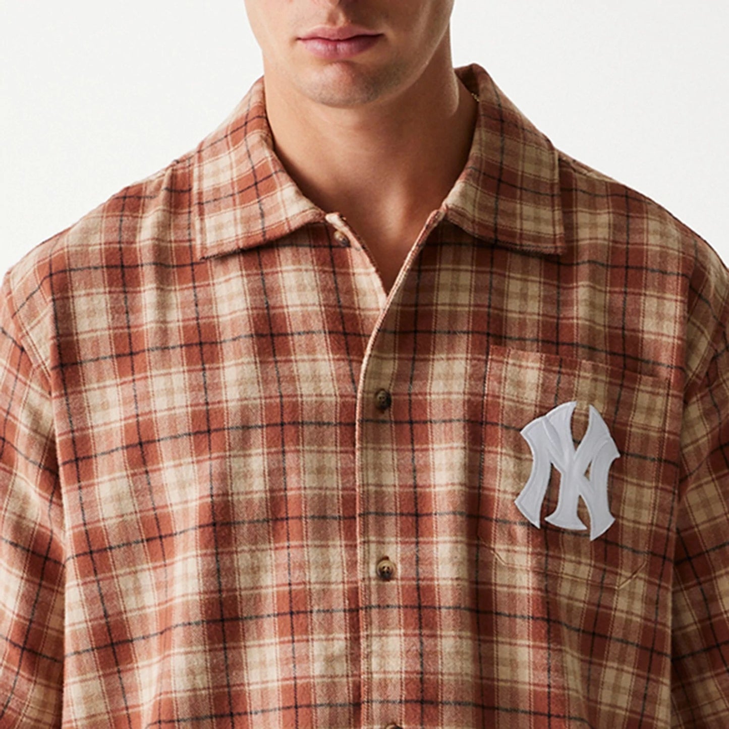 The Male model is wearing New York Yankees Plaid Brown Short Sleeve Shirt 6