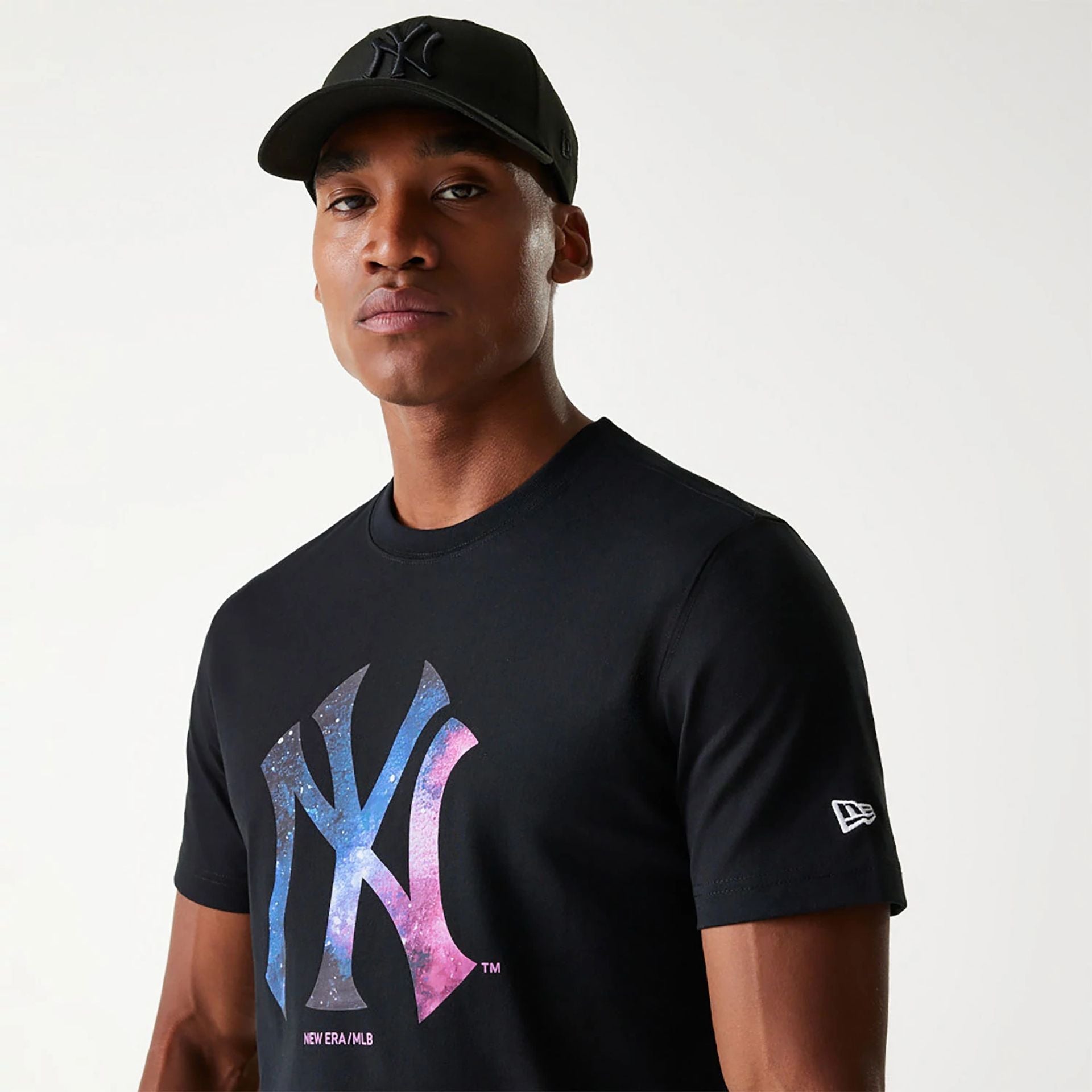 The Male model is wearing New York Yankees Cosmic Space Black T-Shirt 5