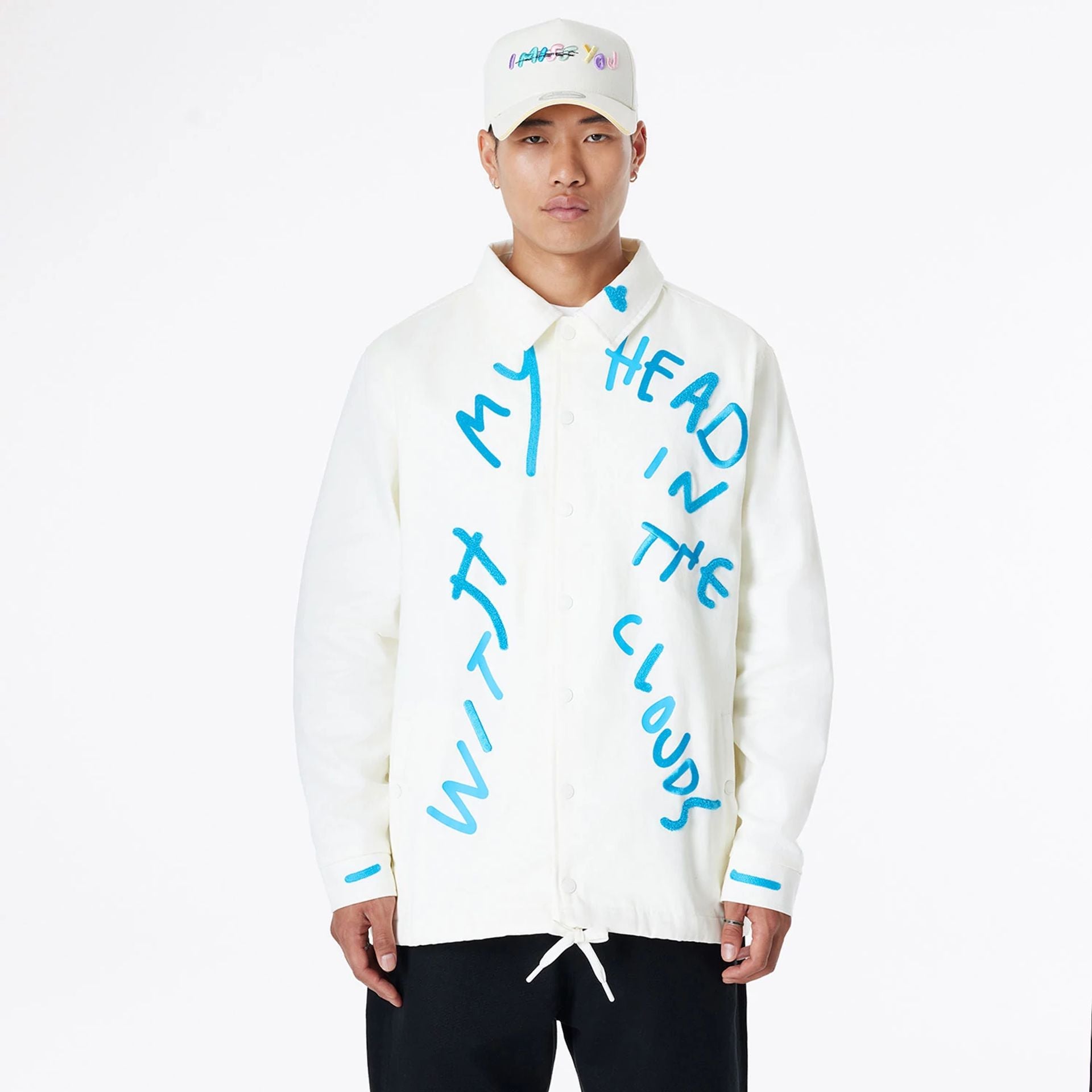 The Male model is wearing Ricardo Luévanos x New Era White Coach Jacket 1