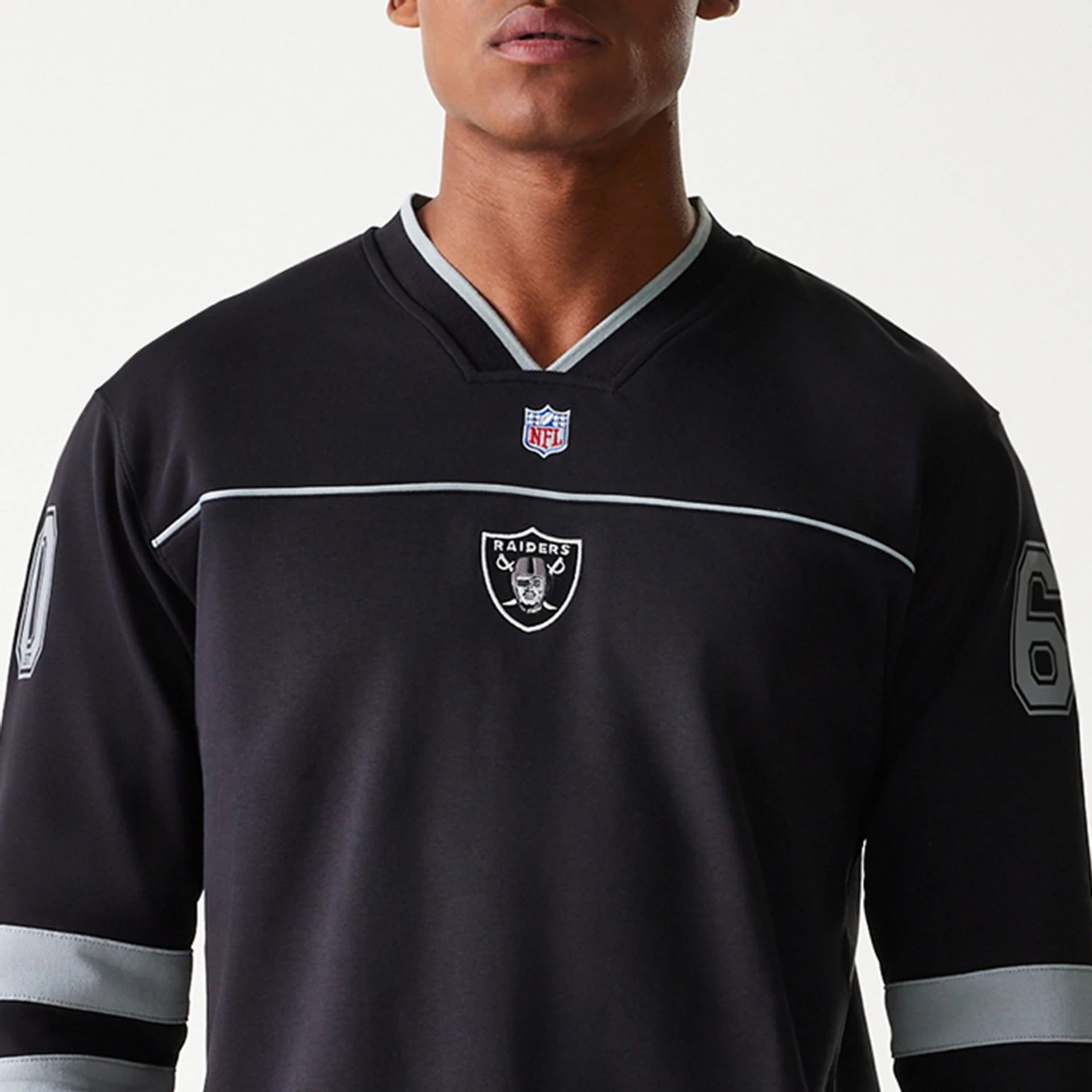 The Male model is wearing Las Vegas Raiders Korea Black Long Sleeve T-Shirt 3