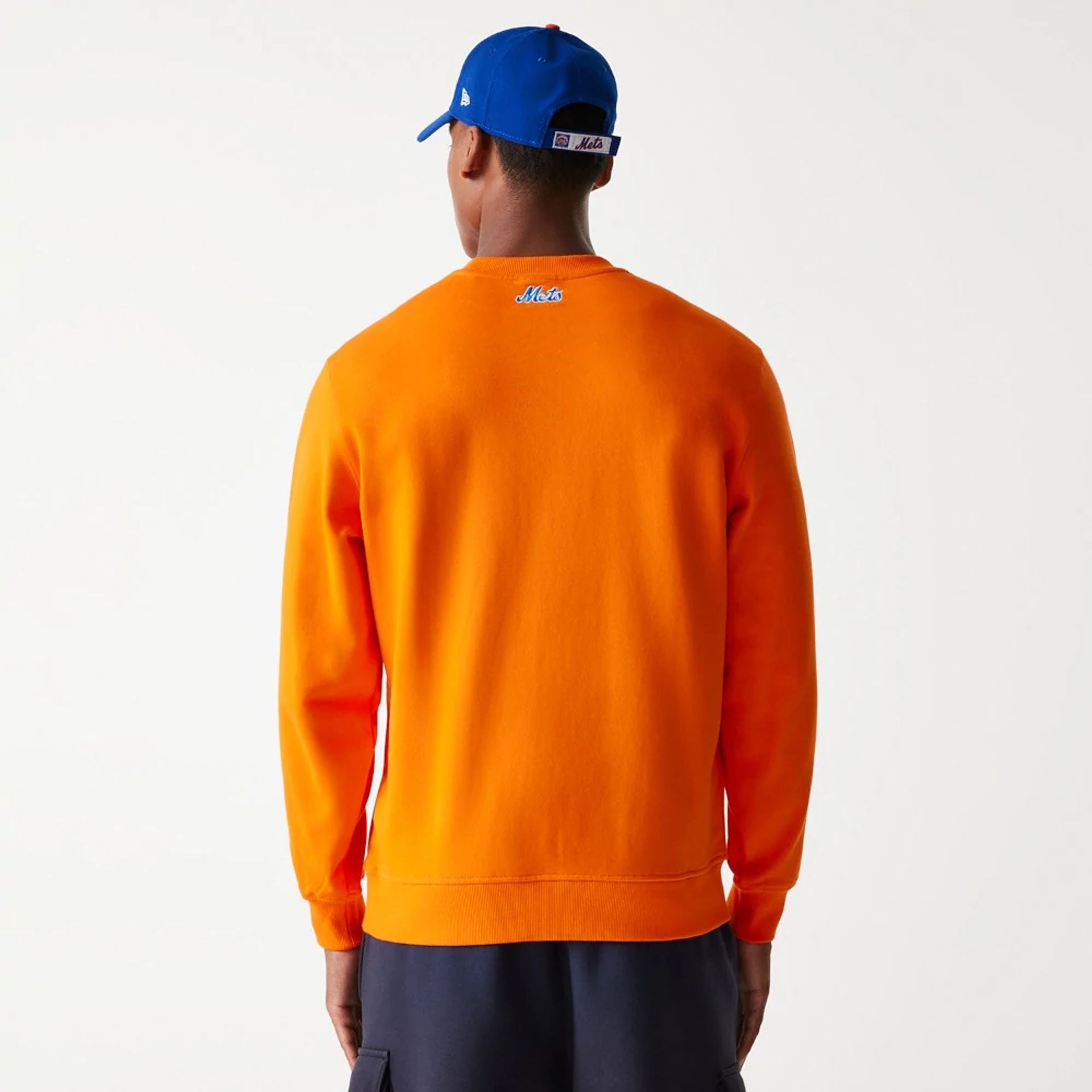 The Male model is wearing New York Mets Korea Orange Sweatshirt 2