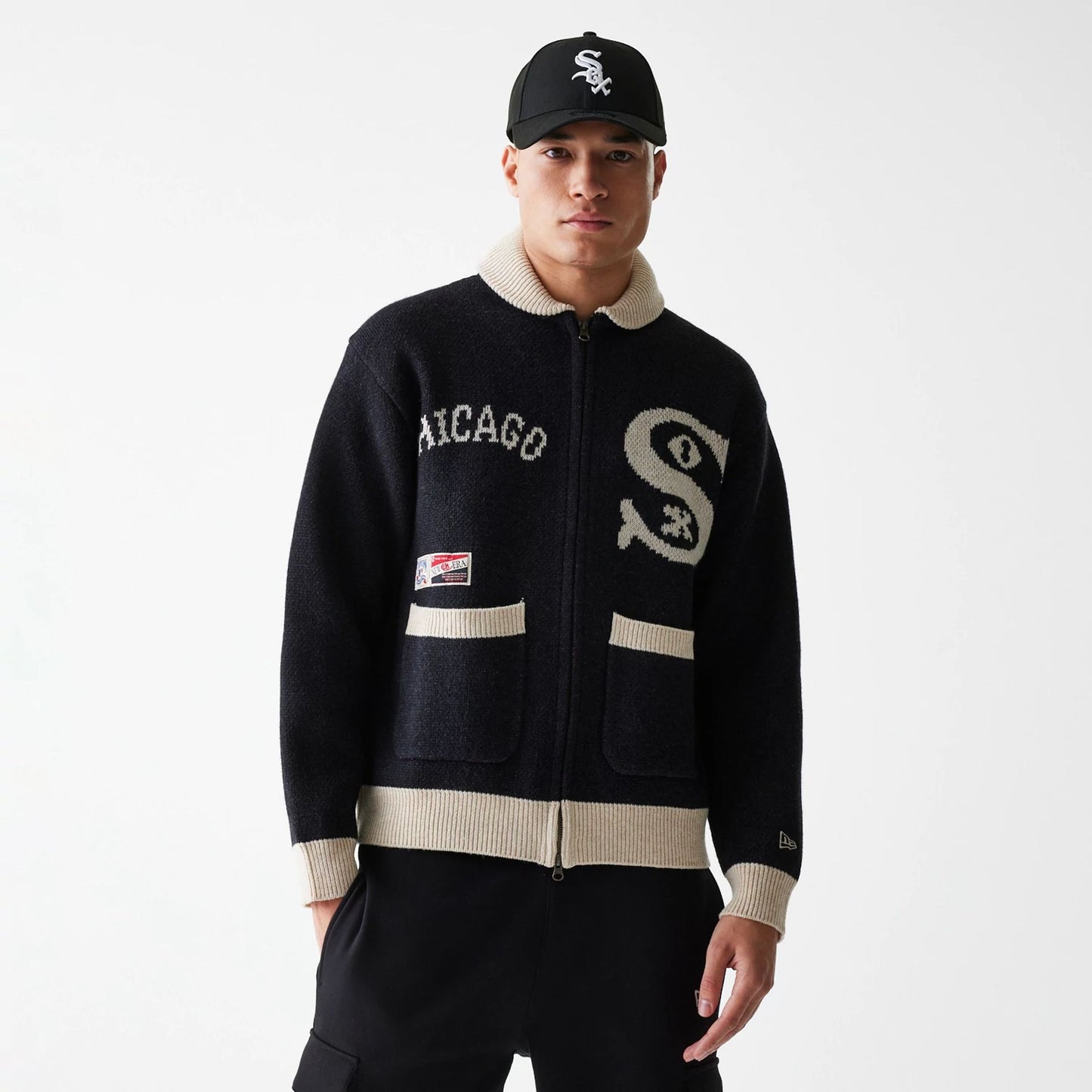 The Male model is wearing Chicago White Sox MLB Cowichan Black Crew Neck Sweater  1