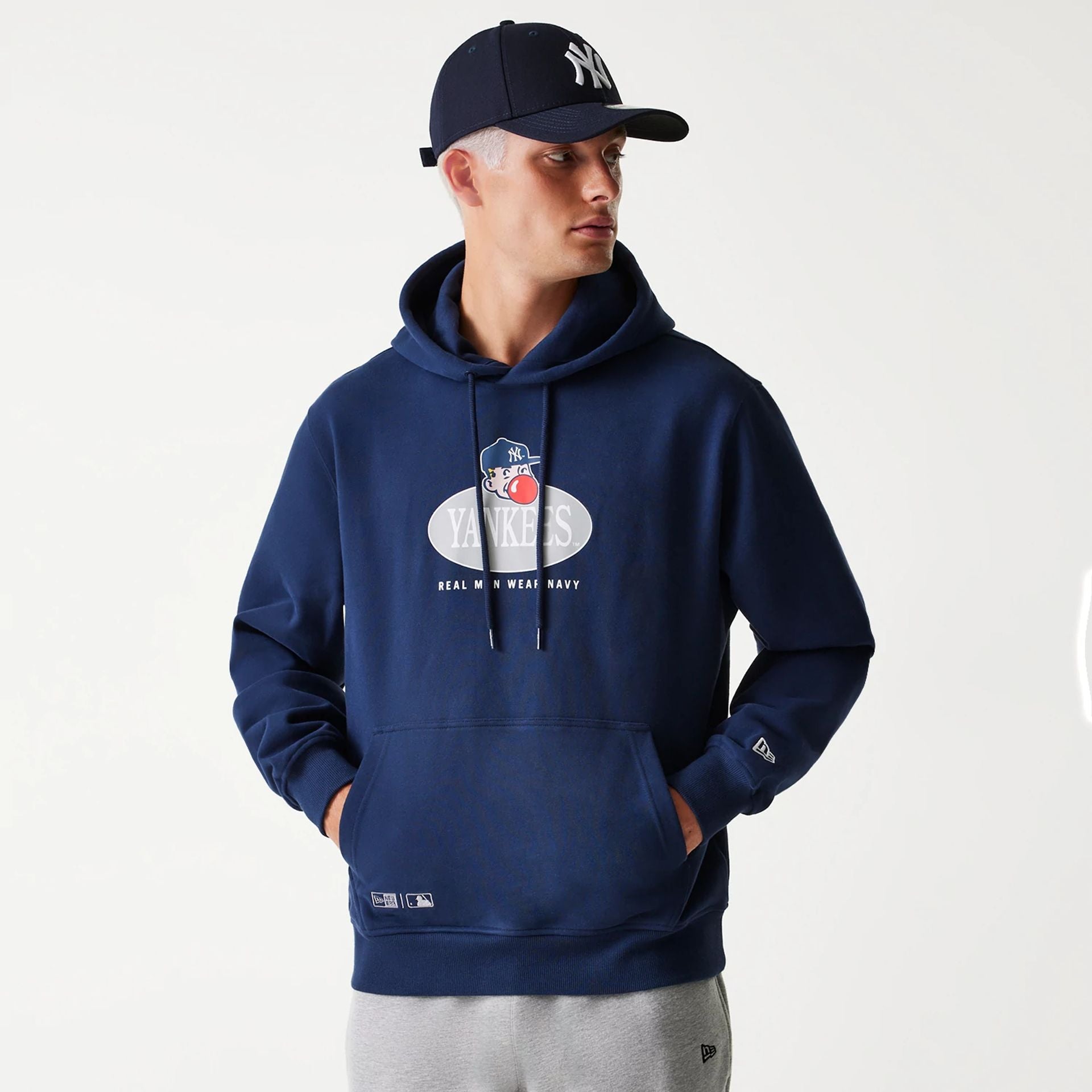 The Male model is wearing New York Yankees Korea Navy Pullover Hoodie 1