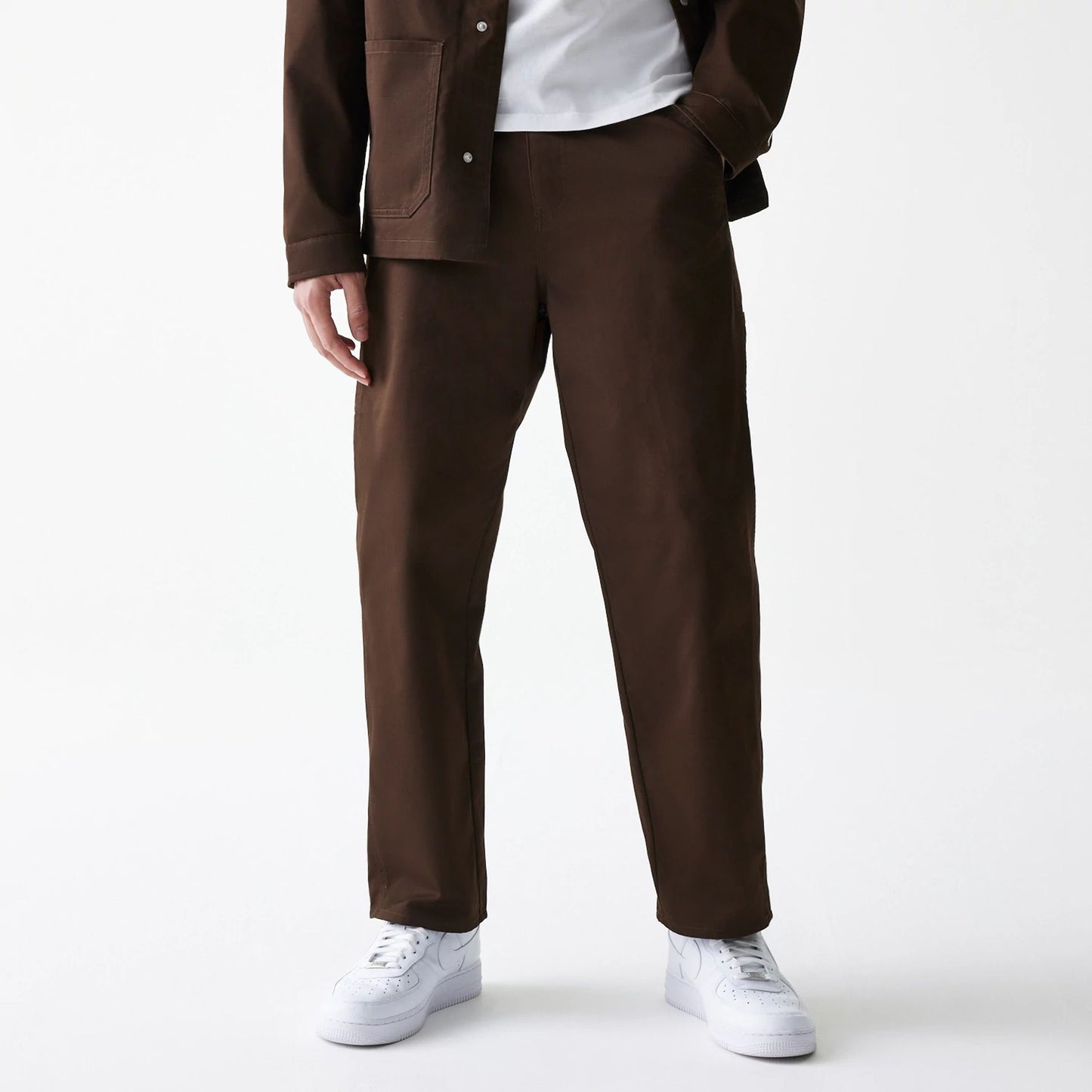 The Male model is wearing New Era Dark Brown Heavy Duty Trousers 7