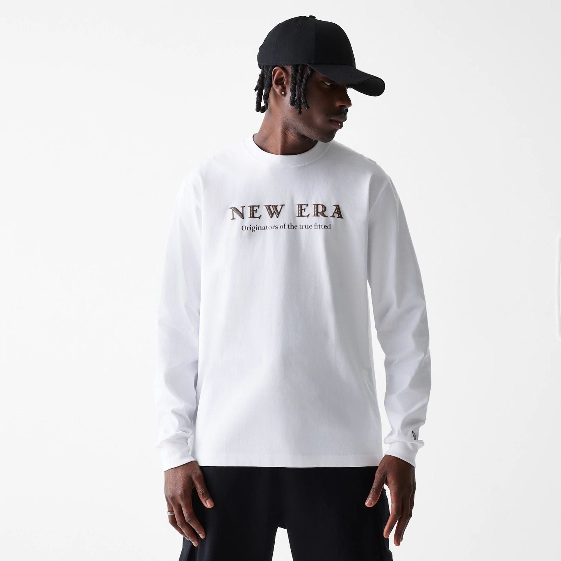 The Male model is wearing New Era Basic White Long Sleeve T-Shirt 1