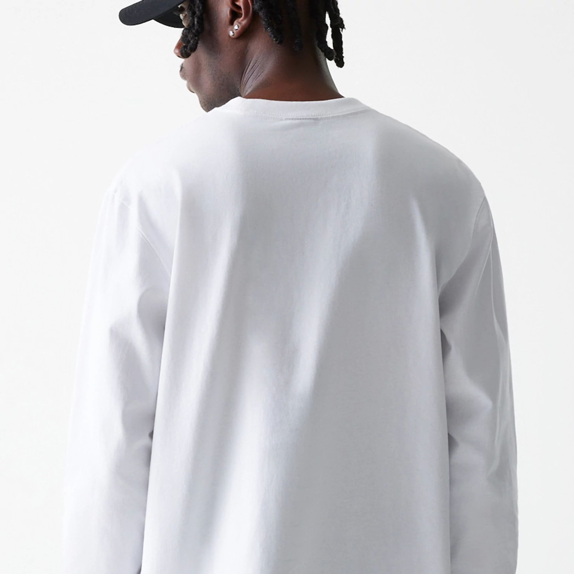 The Male model is wearing New Era Basic White Long Sleeve T-Shirt 7