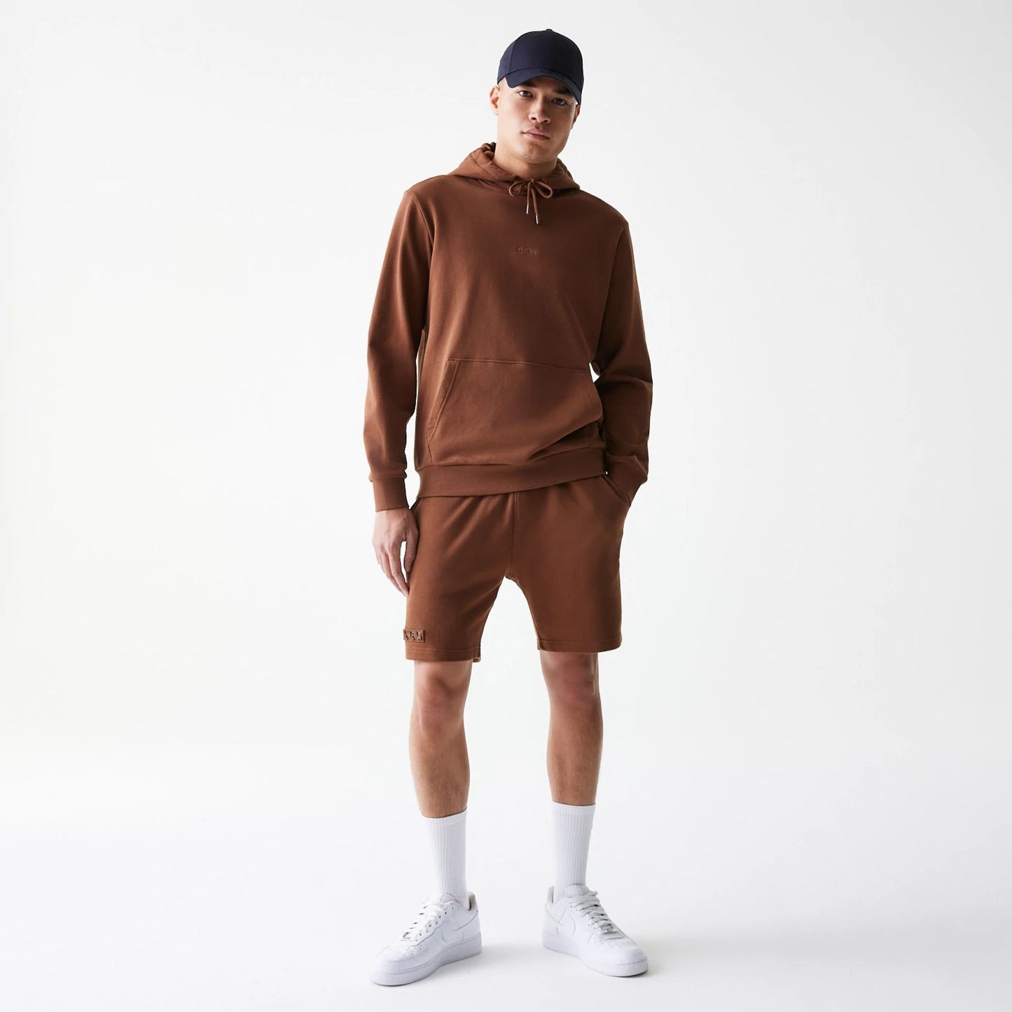 The Male model is wearing New Era Tonal Brown Shorts  8