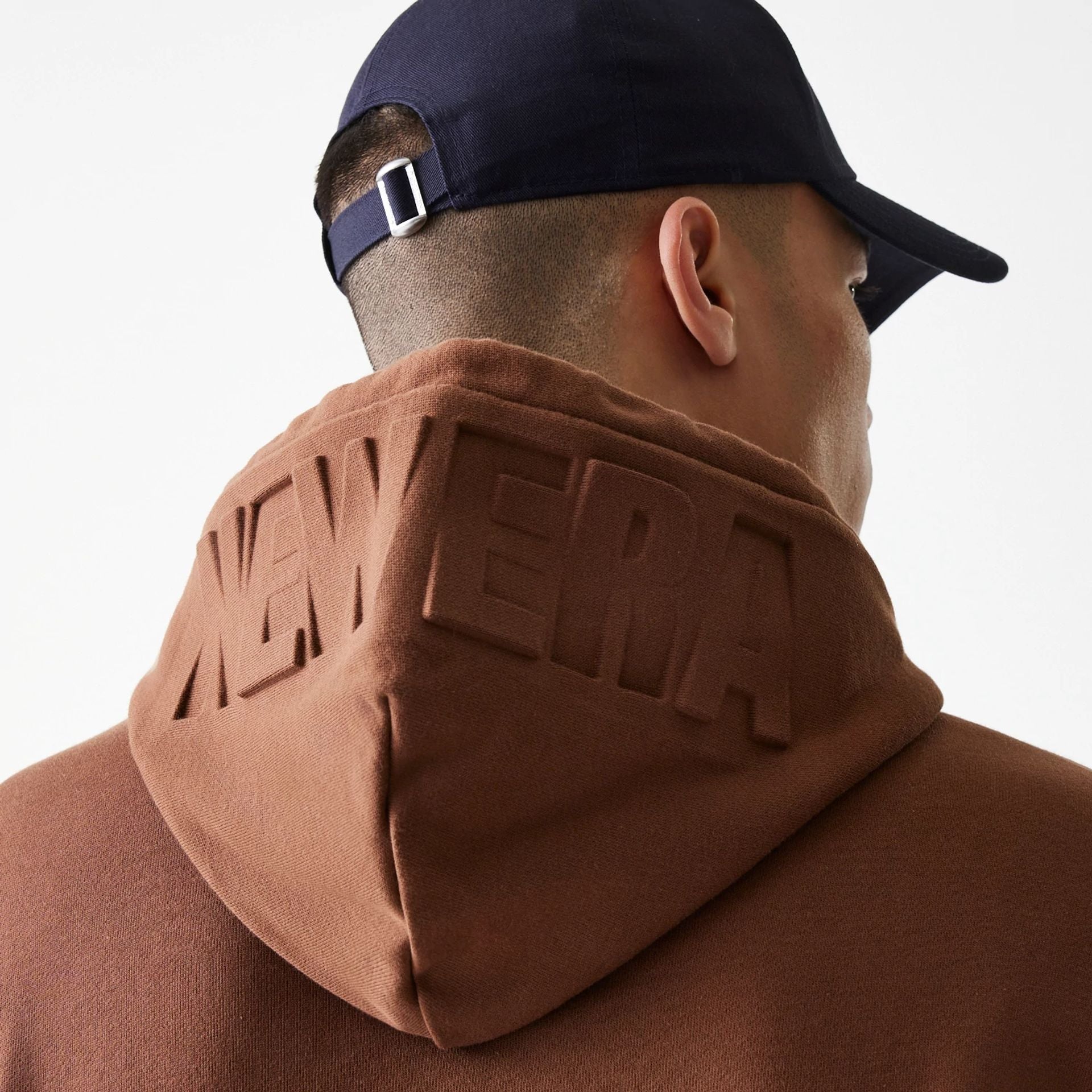 The Male model is wearing New Era Tonal Brown Pullover Hoodie  2