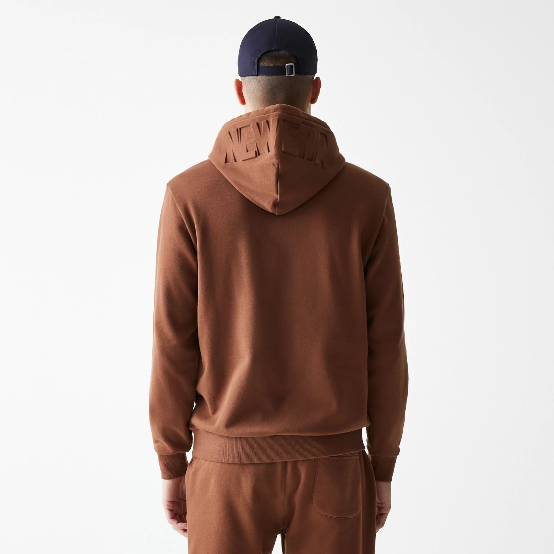 The Male model is wearing New Era Tonal Brown Pullover Hoodie  3