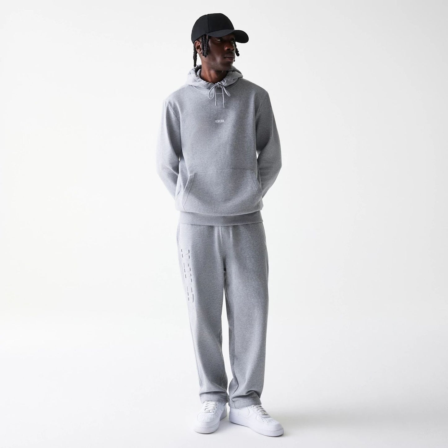 The Male model is wearing New Era Tonal Grey Pullover Hoodie  8