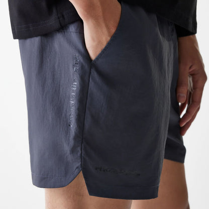 The Male model is wearing Hermanos Koumori x New Era Dark Grey Shorts 3