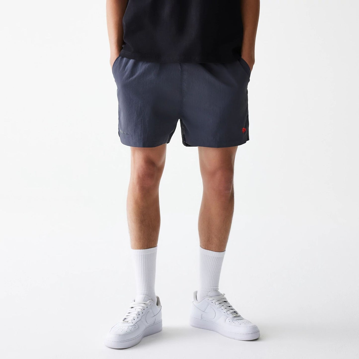 The Male model is wearing Hermanos Koumori x New Era Dark Grey Shorts 7