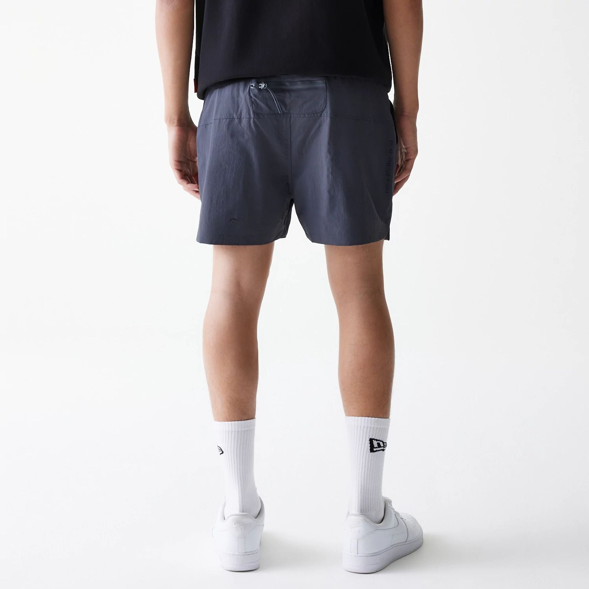 The Male model is wearing Hermanos Koumori x New Era Dark Grey Shorts 2