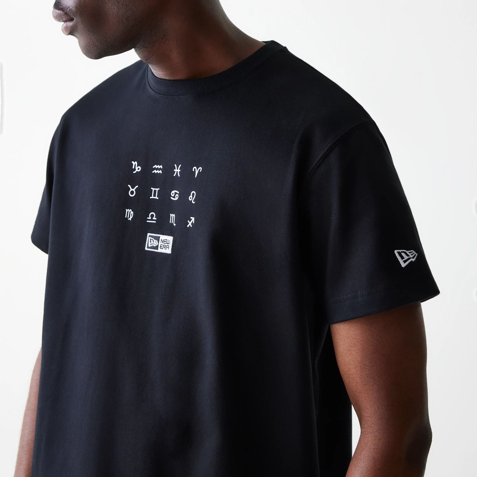 The Male model is wearing New Era Zodiac Black T-Shirt 5