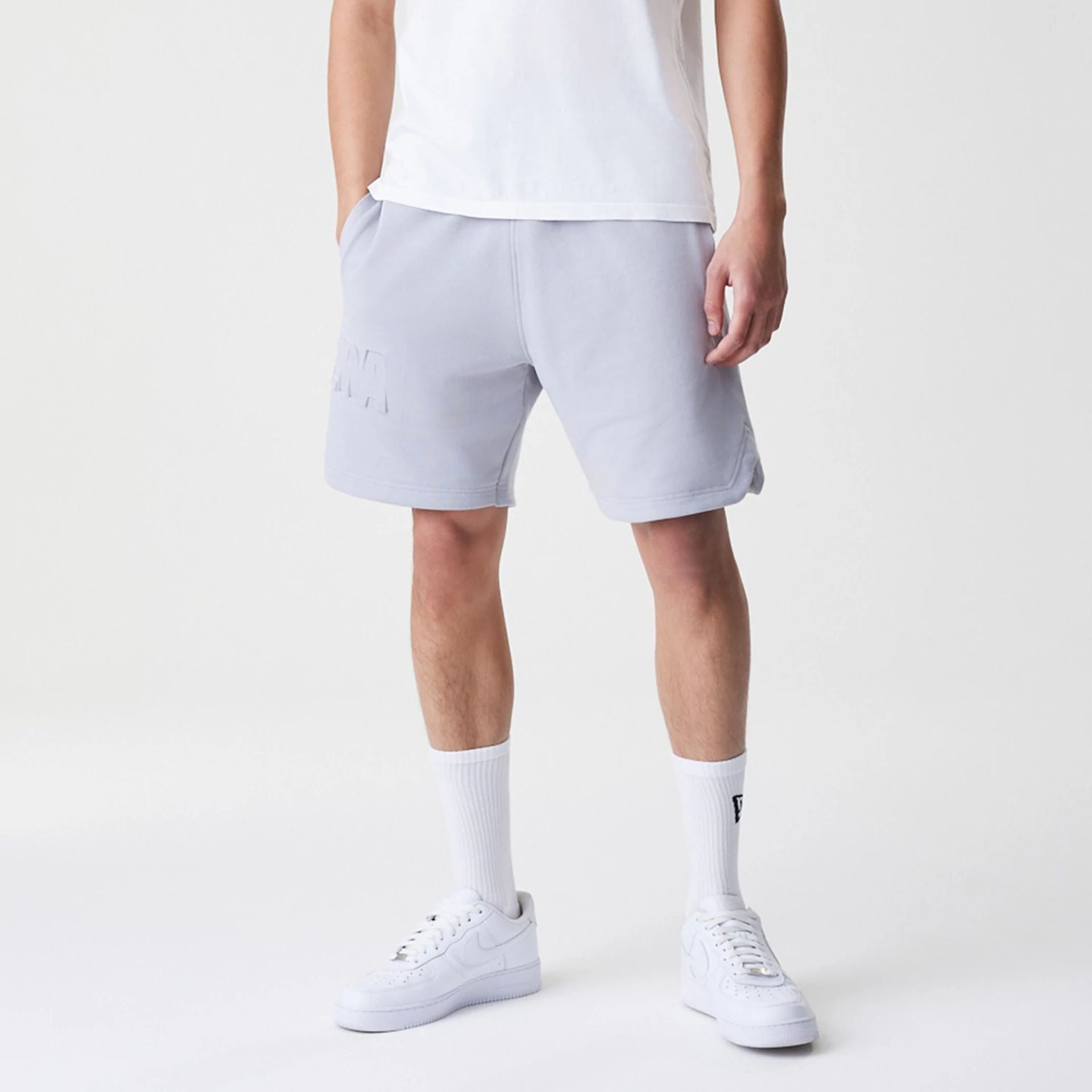 The Male model is wearing New Era Tonal Pack Grey Shorts 1