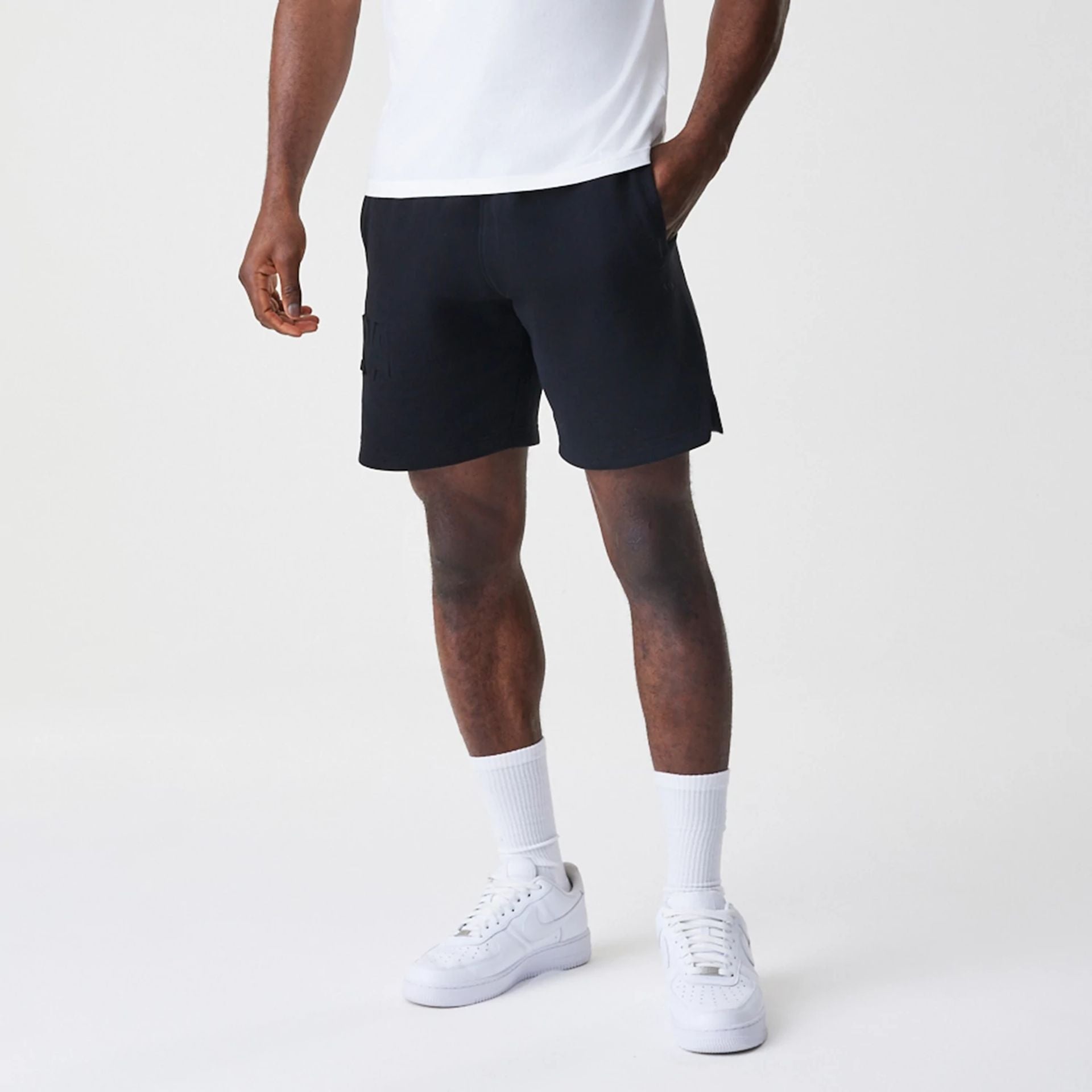 The Male model is wearing New Era Tonal Pack Black Shorts 1