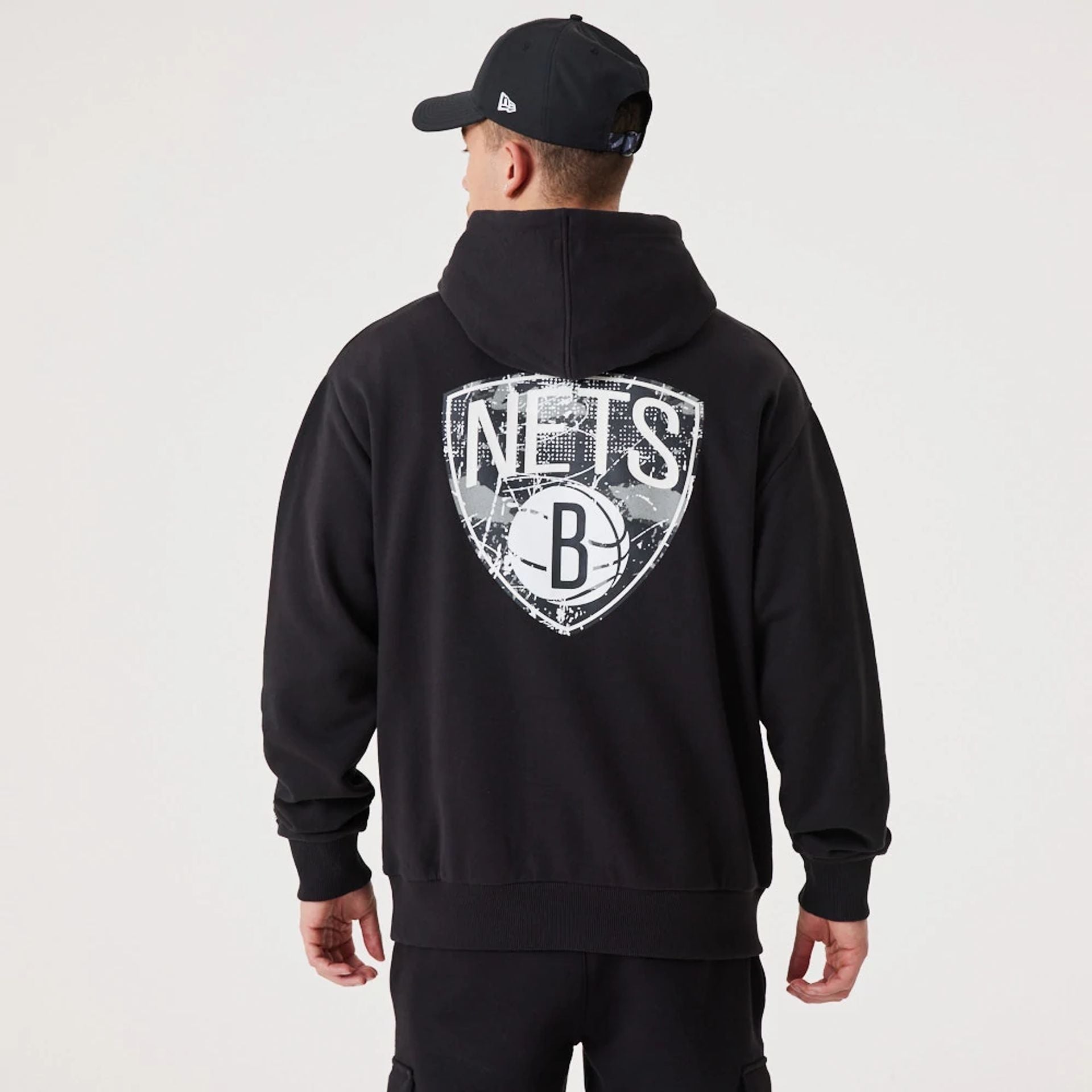 The Male model is wearing Brooklyn Nets NBA Infill Team Logo Black Pullover Hoodie 1