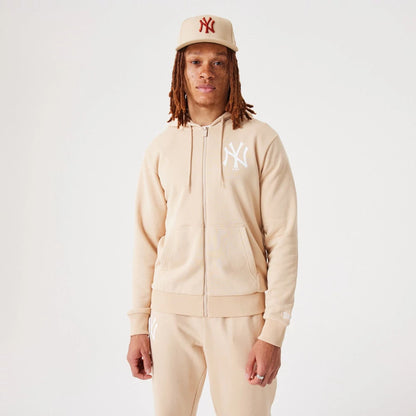 The Male model is wearing New York Yankees MLB League Essential Light Beige Full-Zip Hoodie 2