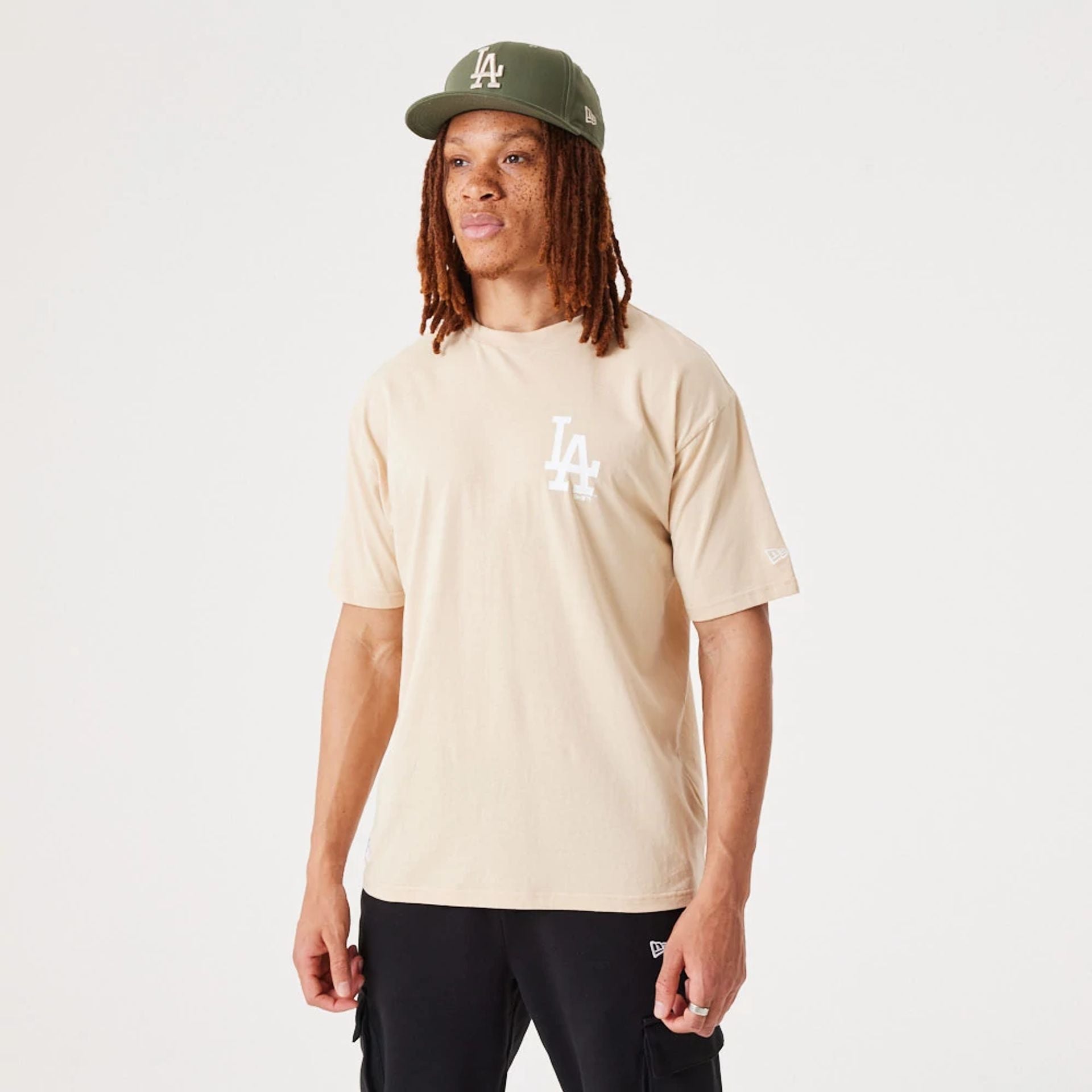 The Male model is wearing LA Dodgers MLB League Essential Light Beige Oversized T-Shirt 2