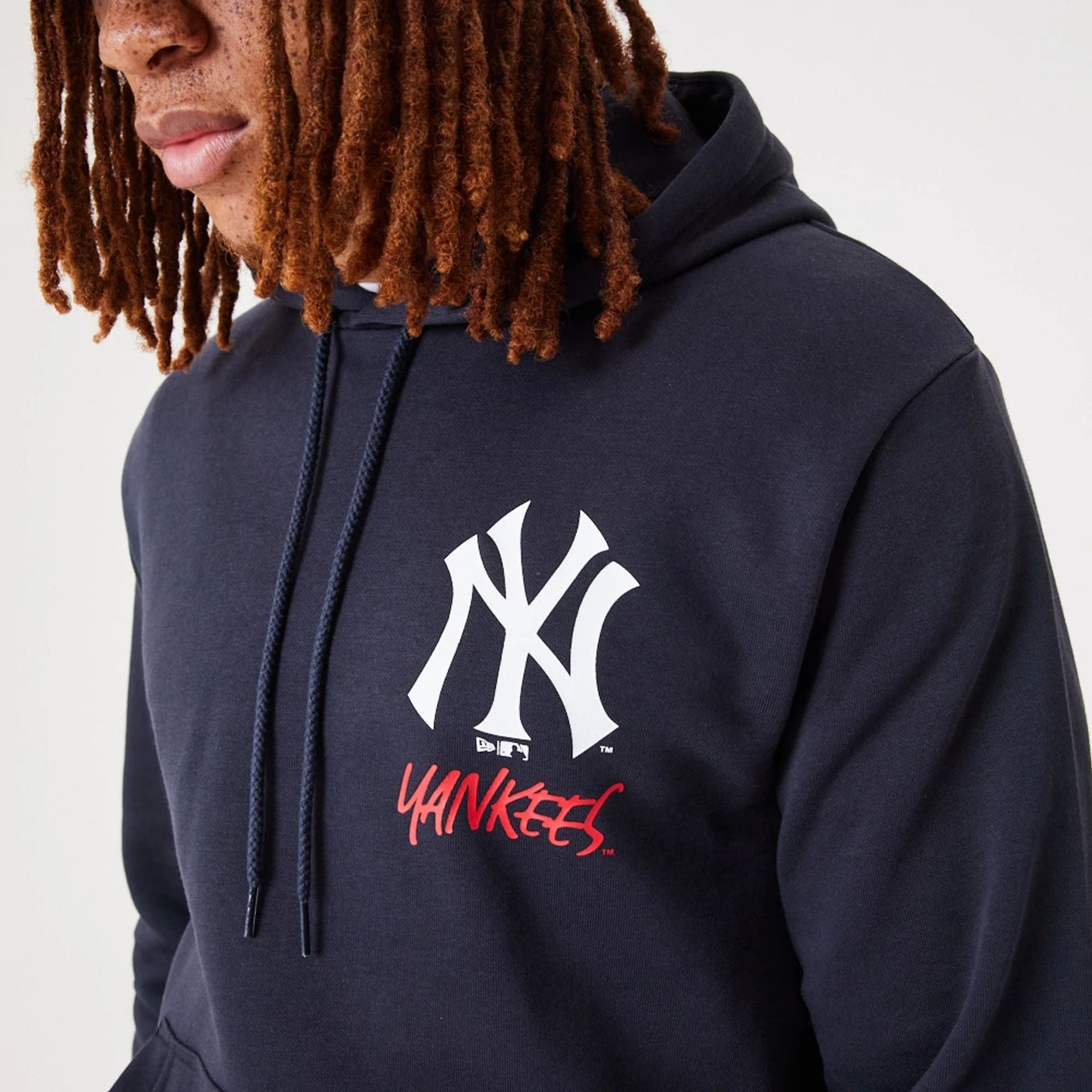 The Male model is wearing New York Yankees MLB Team Logo Navy Pullover Hoodie 2